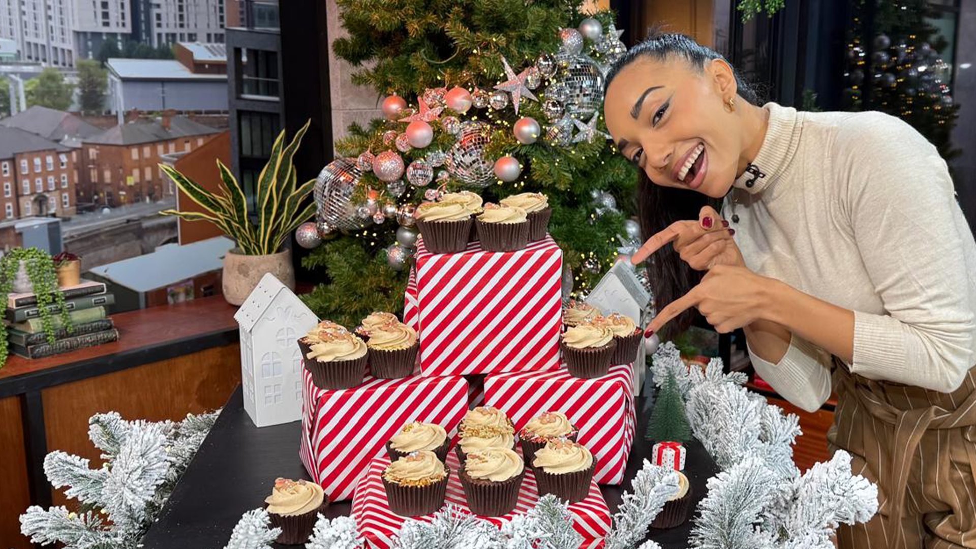 Michelle's sticky toffee gingerbread cupcakes in the Morning Live studio surrounded by Christmas presents and festive decorations.