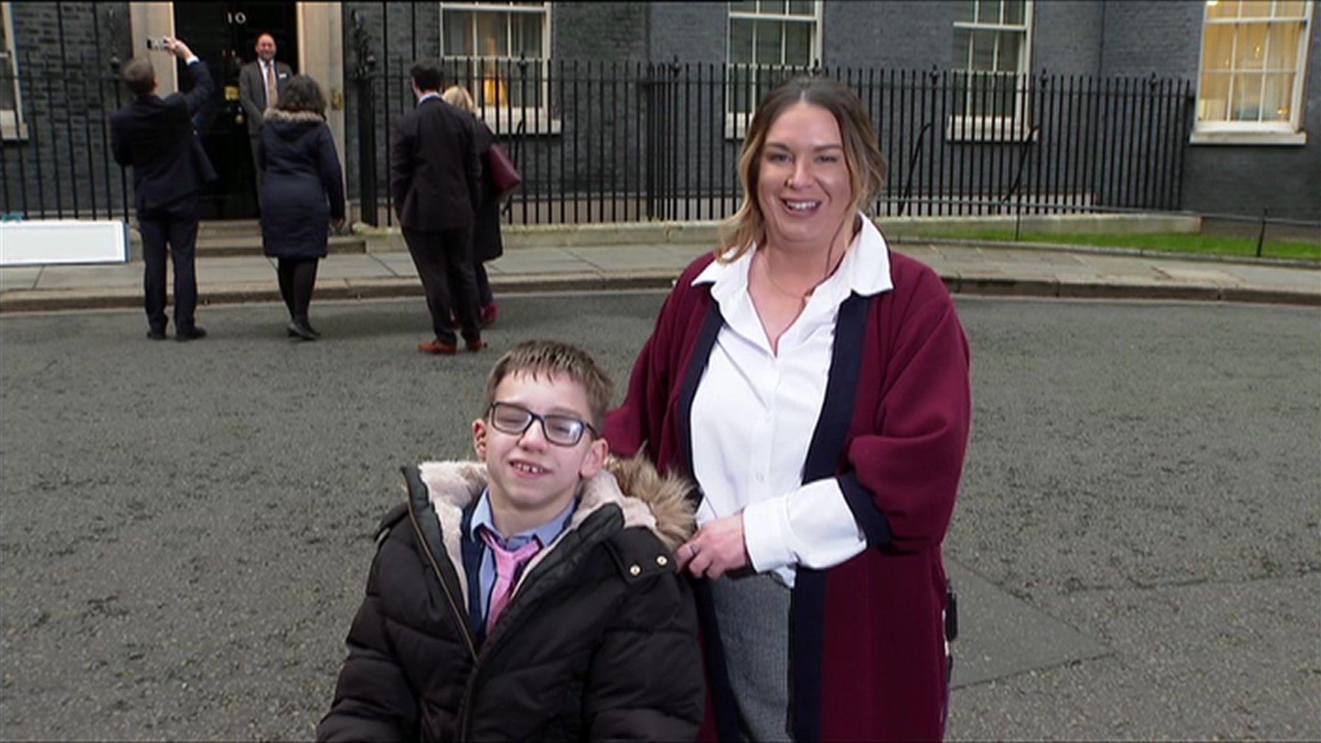 Zach Eagling and Claire Keer outside Downing Street after receiving a special award from the Prime Minister