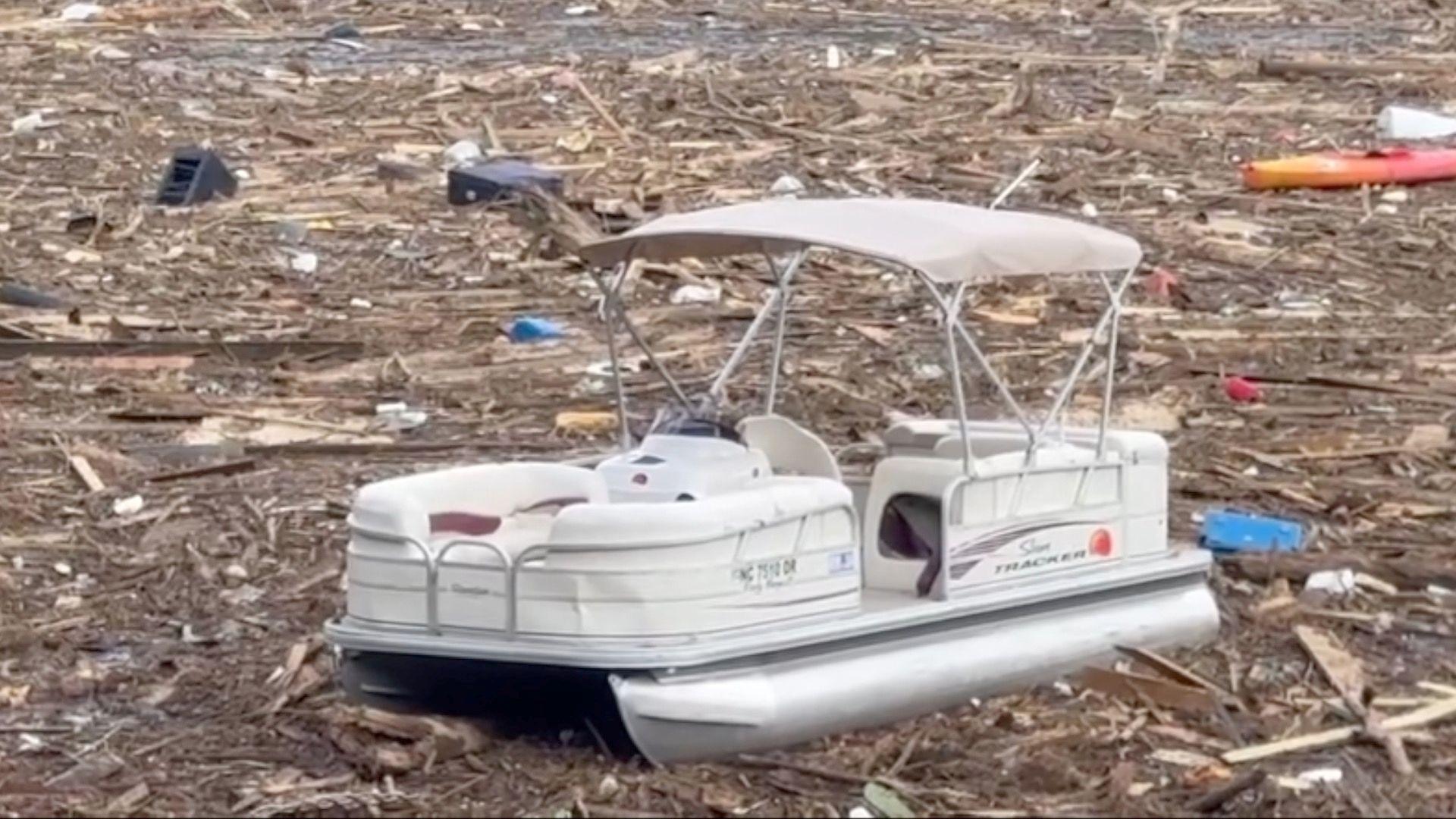 Boat surrounded by debris