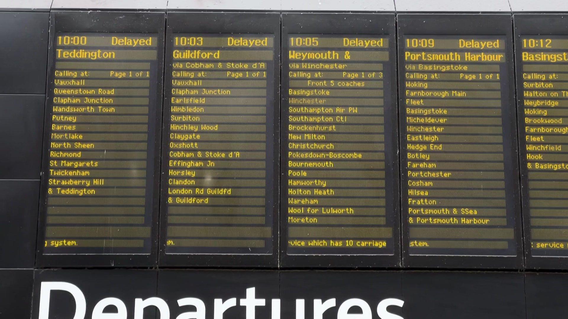 Departure board saying delayed for a number of services