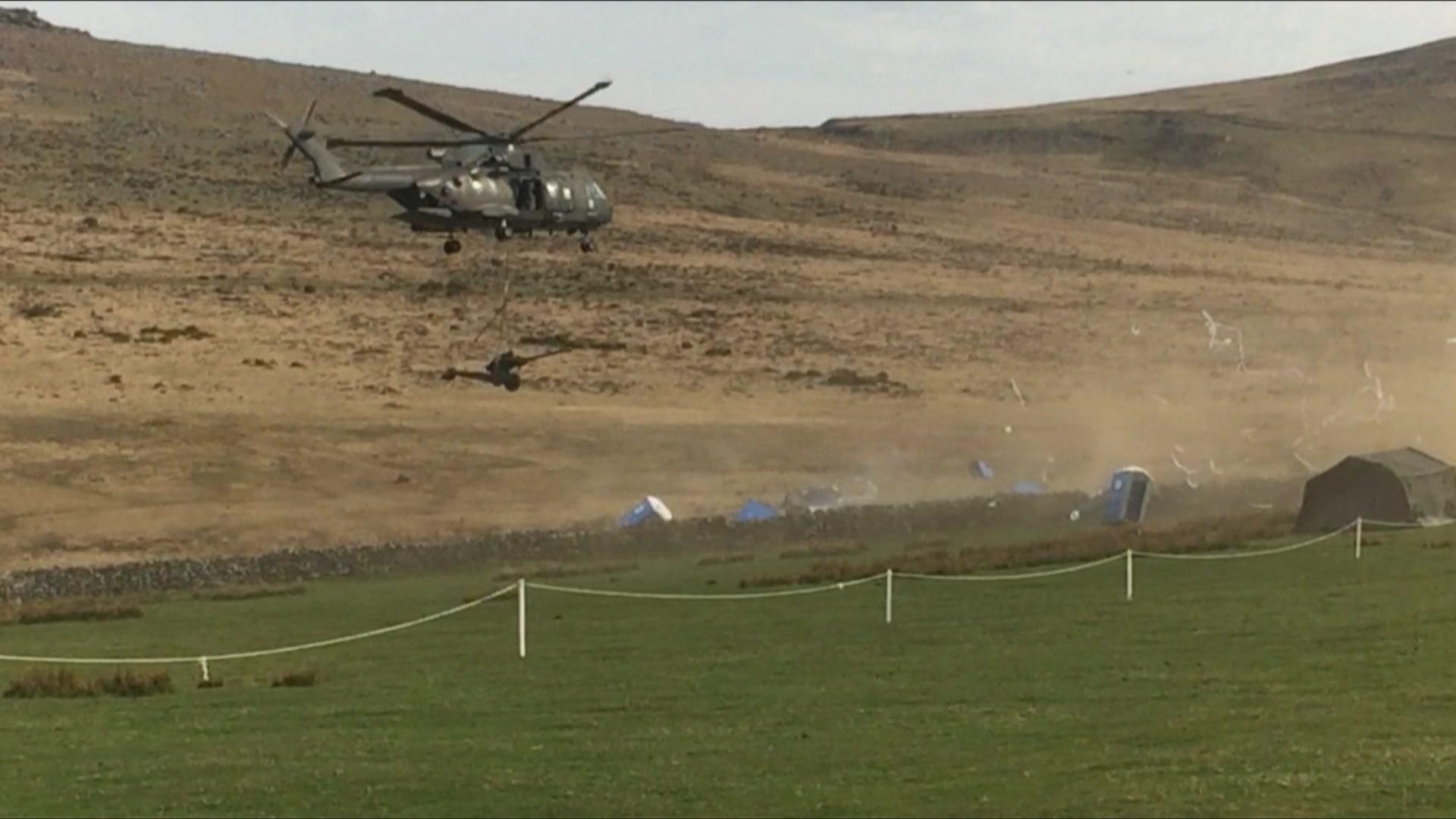 Helicopter knocking over portable toilets