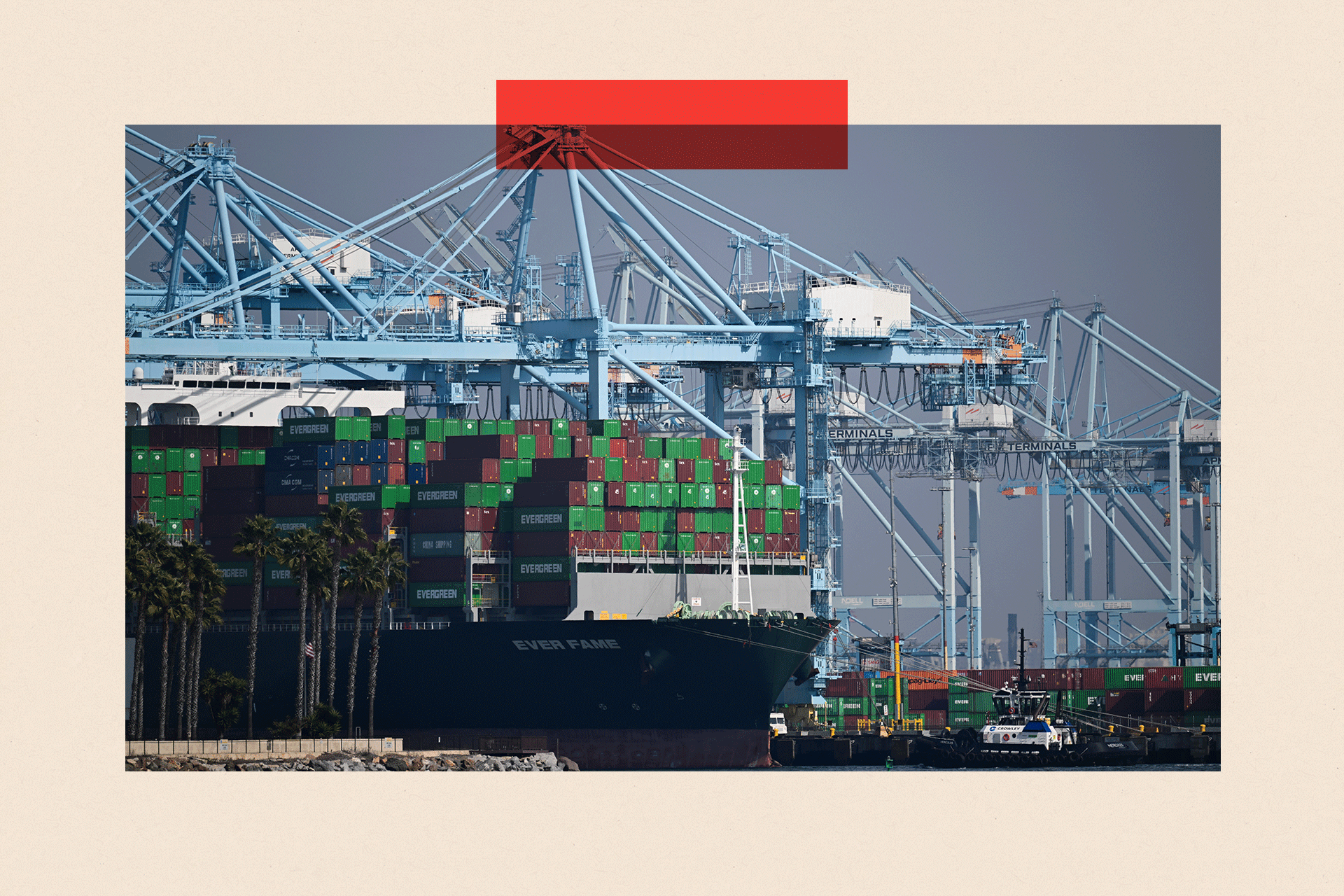 Cargo shipping containers sit on a container ship docked at a container terminal at the Port of Los Angeles, California
