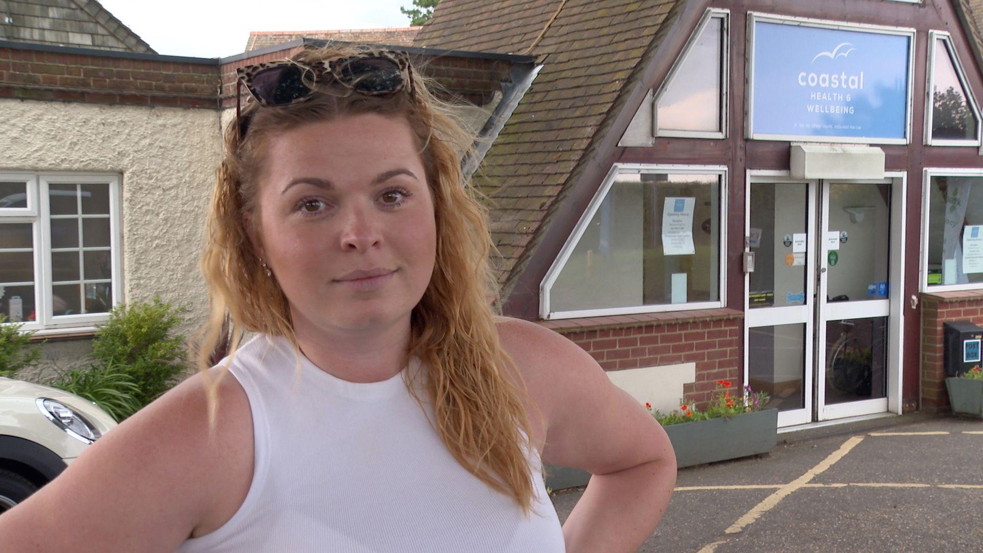 Emily Kelly standing outside the Old Cottage Hospital in Wells