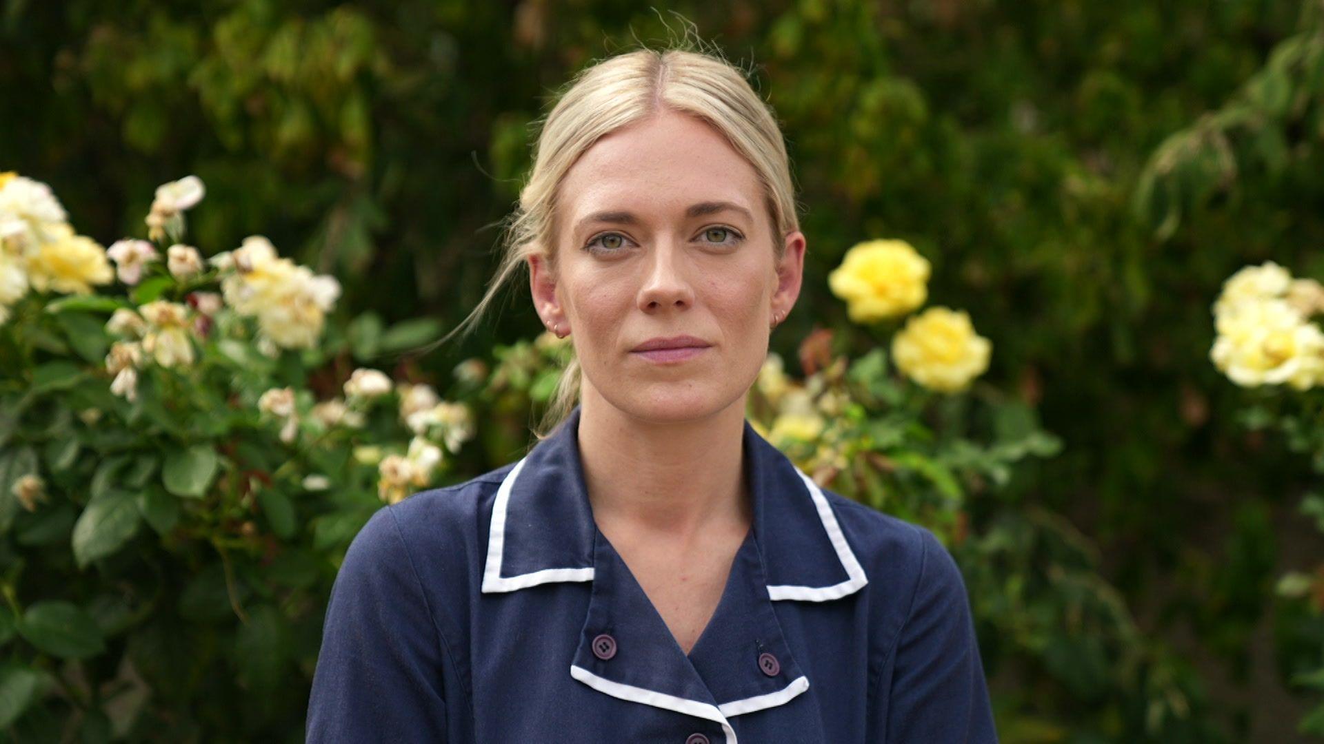 Senior nurse Jess Turnbull in her navy uniform outside.
