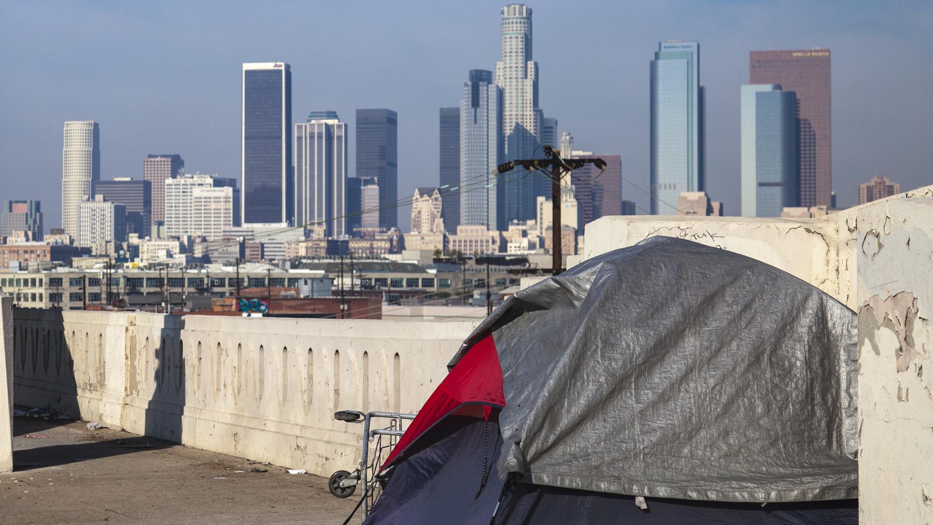 LA skyline and a tent