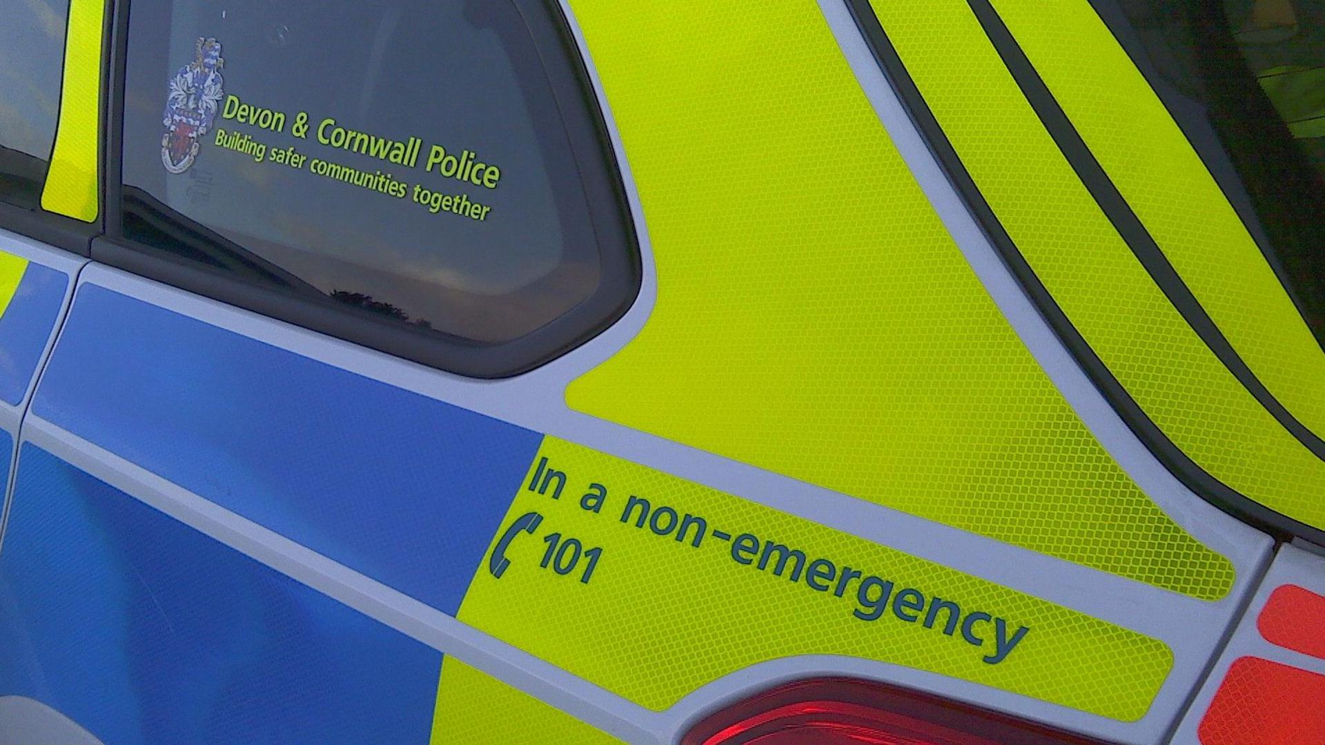 A police car with the Devon and Cornwall Police logo on the side.