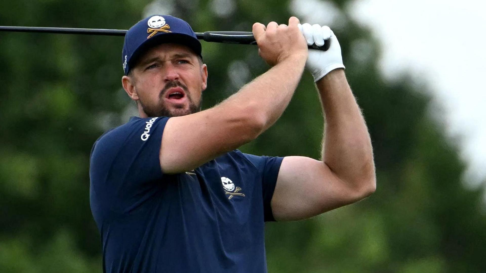 Bryson DeChambeau hitting a golf shot