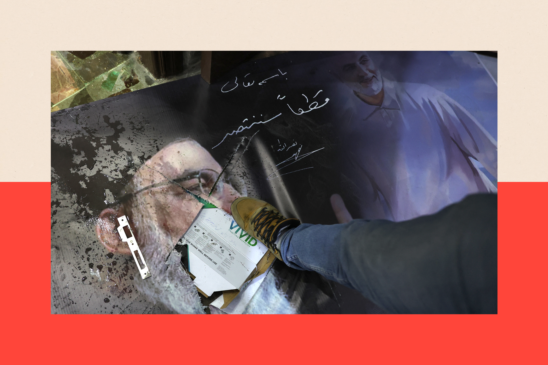 A man steps on a damaged portrait of slain Hezbollah leader Hassan Nasrallah and Iran's late general Qassem Soleimani 