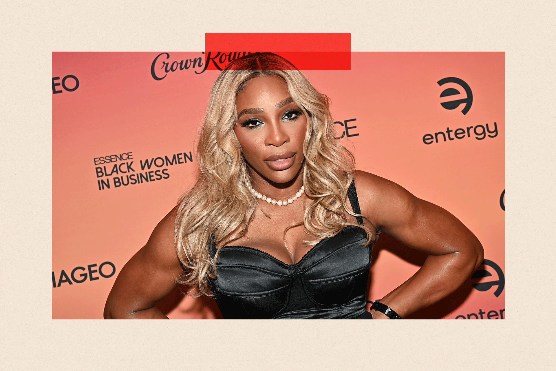 Serena Williams looking serious with her hands on her hips
