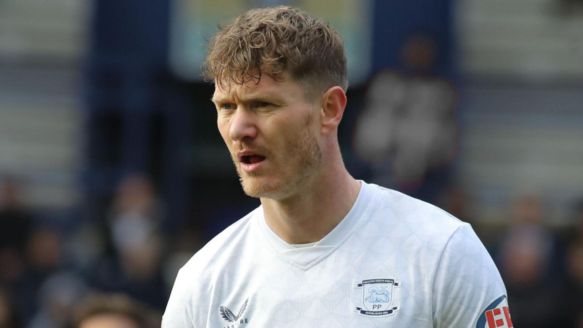 Michael Smith, wearing Preston North End's white home shirt, pictured during a Championship game against Norwich City at Deepdale in December 2025
