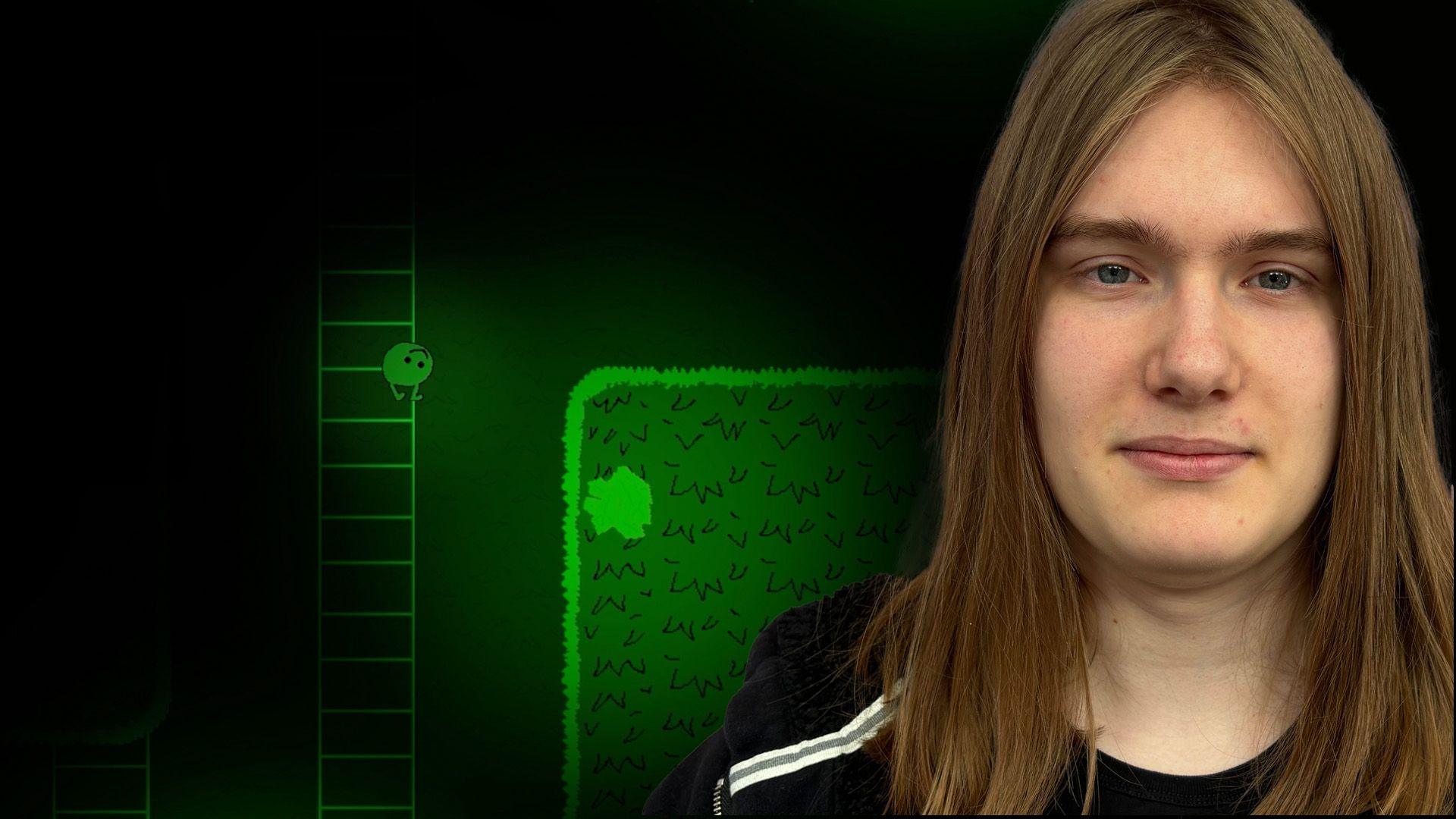 Dylan in front of his game 'Kompis And The Wells Of Fontis'.