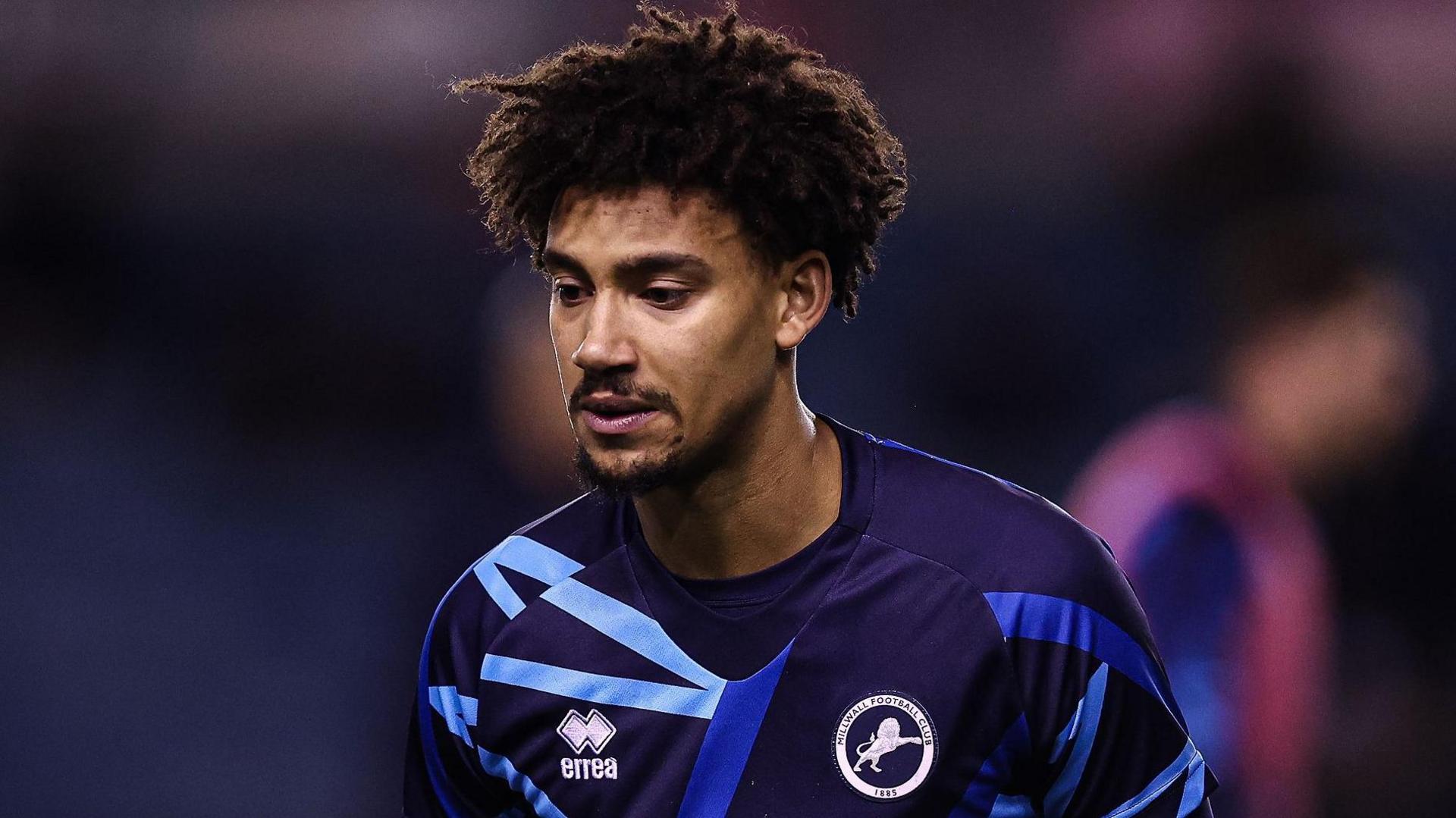George Walker in a Millwall training top ahead of a match