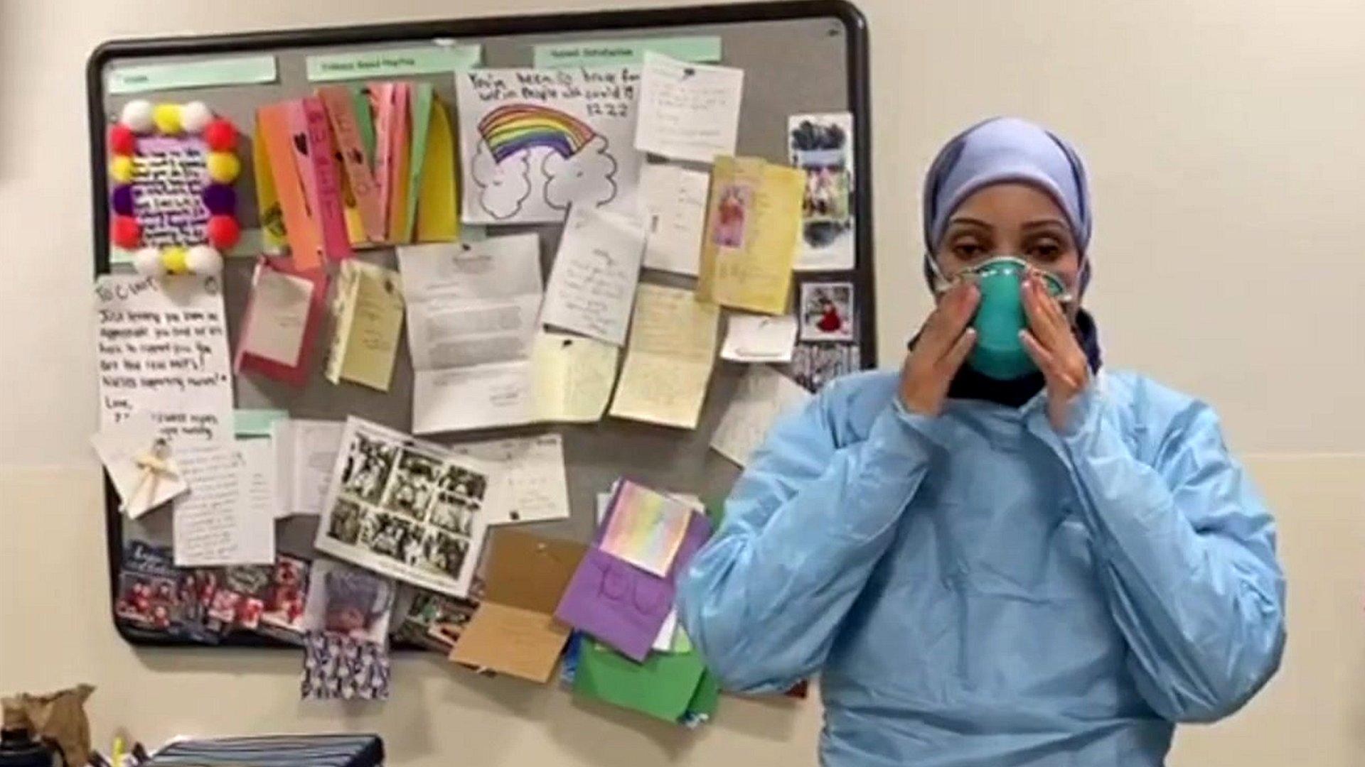 Woman putting on a mask