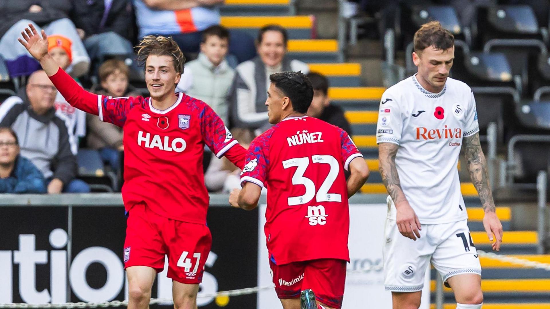 Jack Clarke celebrates as Josh Tymon looks dejected