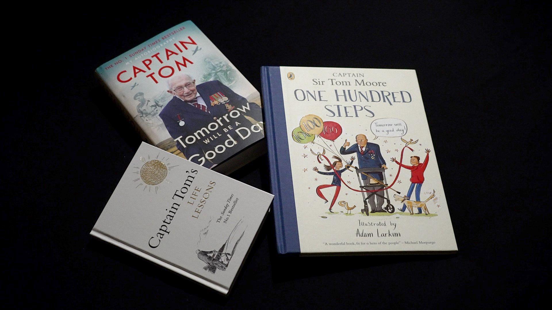 A display of Captain Tom's three books; Tomorrow Will Be a Good Day; One Hundred Steps, and Captain Tom's Life Lessons