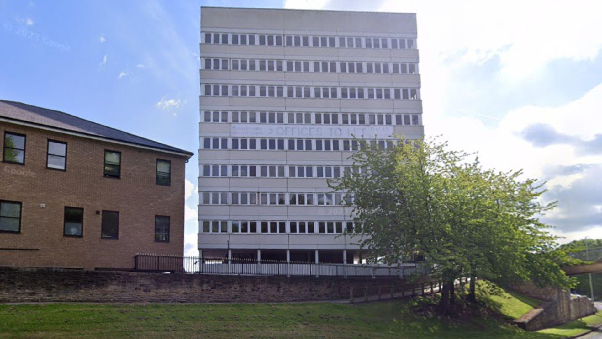 Vinovium House. The tower block building is white and contains a faded "office to let" sign on its external wall.