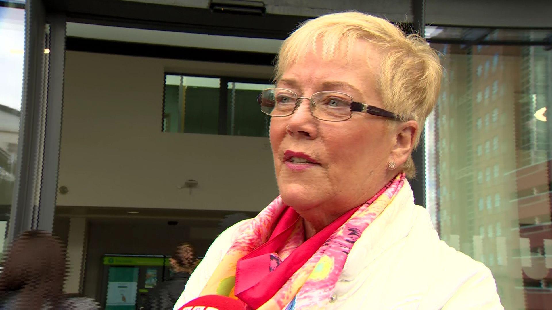 Woman with glasses outside Lanyon Place railway station