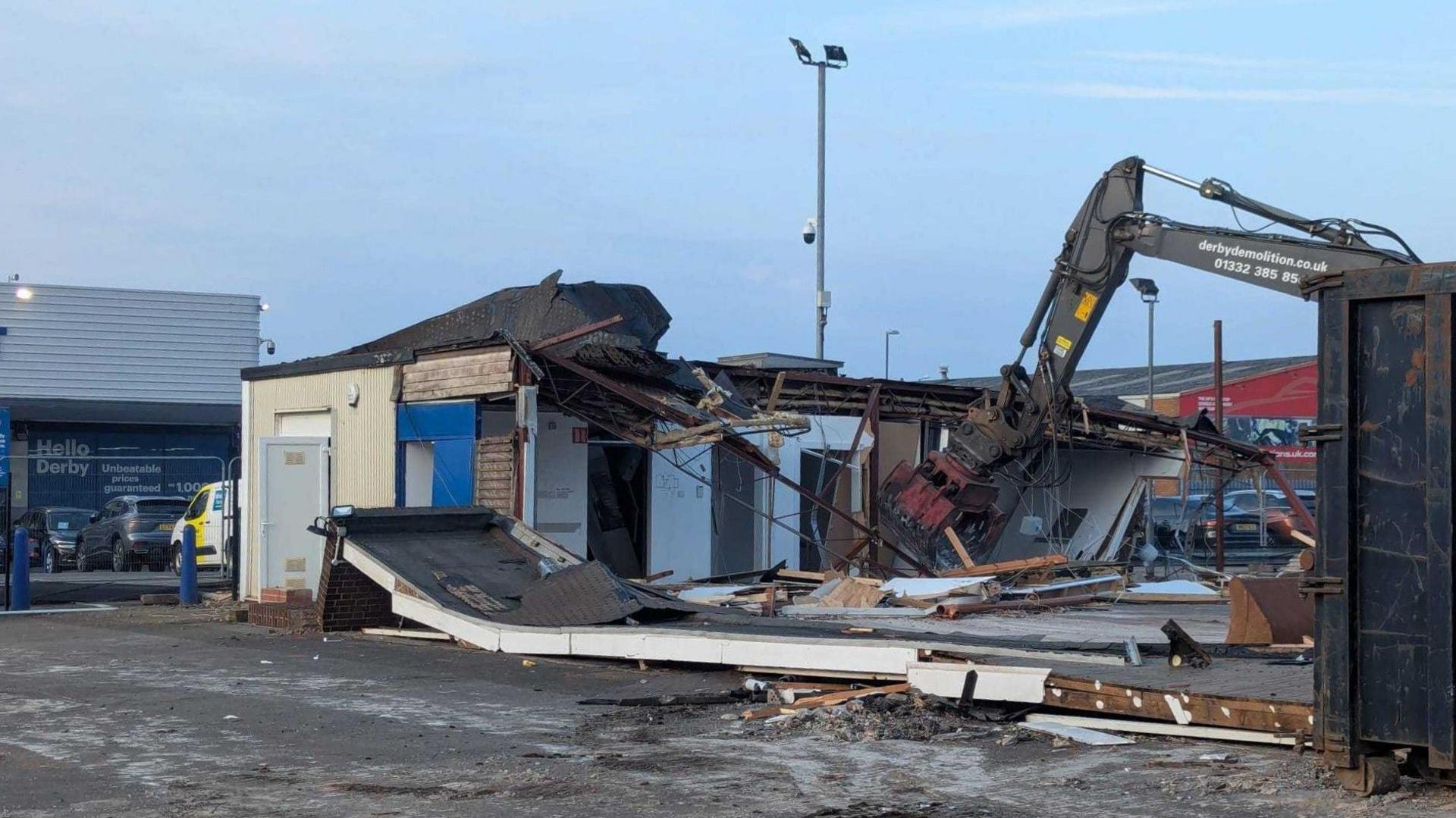 A building on an industrial estate being demolished 