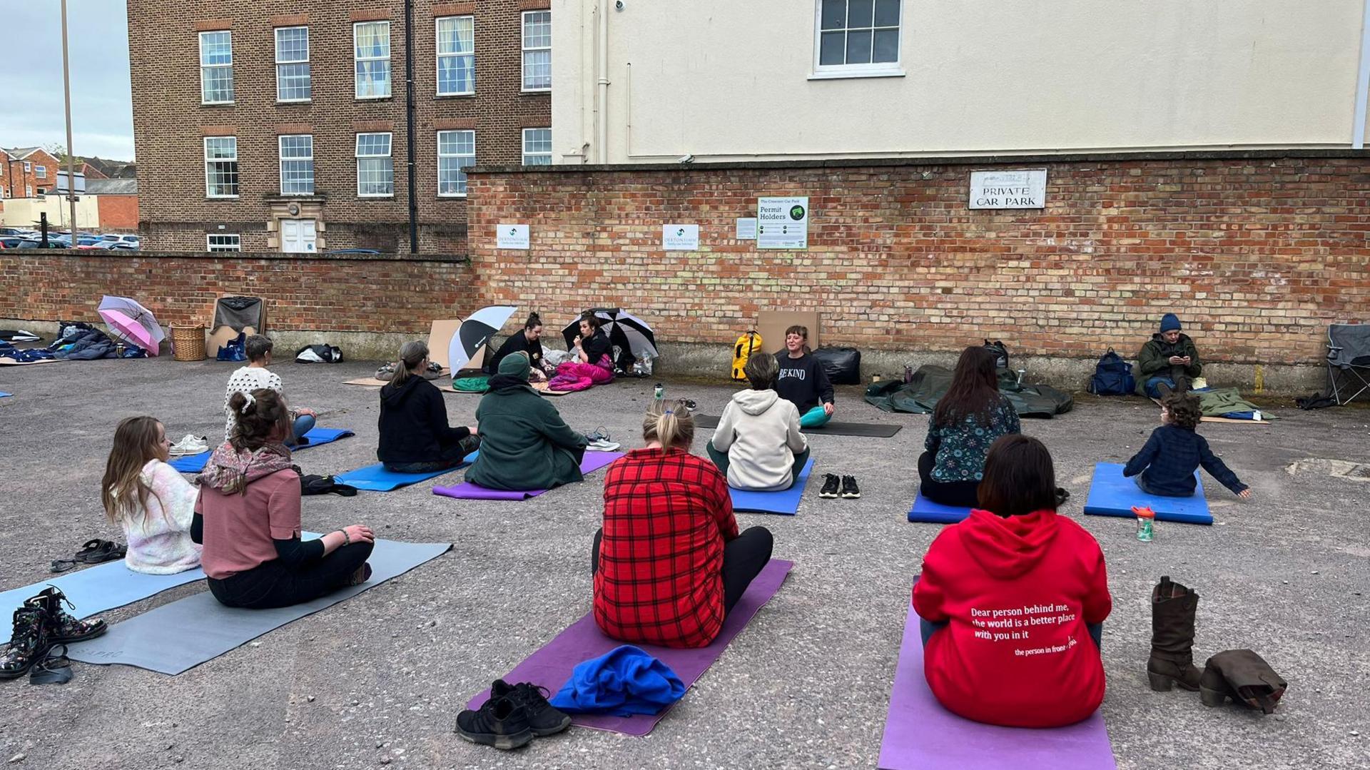 Participants taking part in yoga during the event