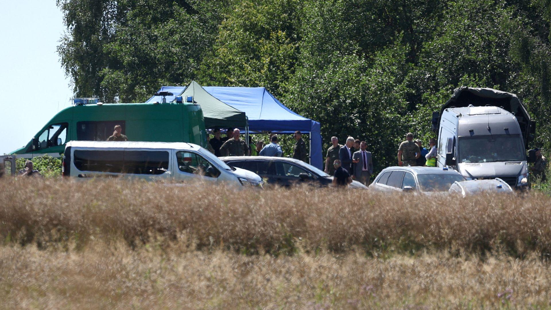 Members of the military and emergency services work near a crater in a field left by an unidentified object that appears to be a Russian missile, Polish Prime Minister Donald Tusk said on Thursday, near the village of Tarnawa-Kolonia in Lublin province, Poland, July 30, 2026.
