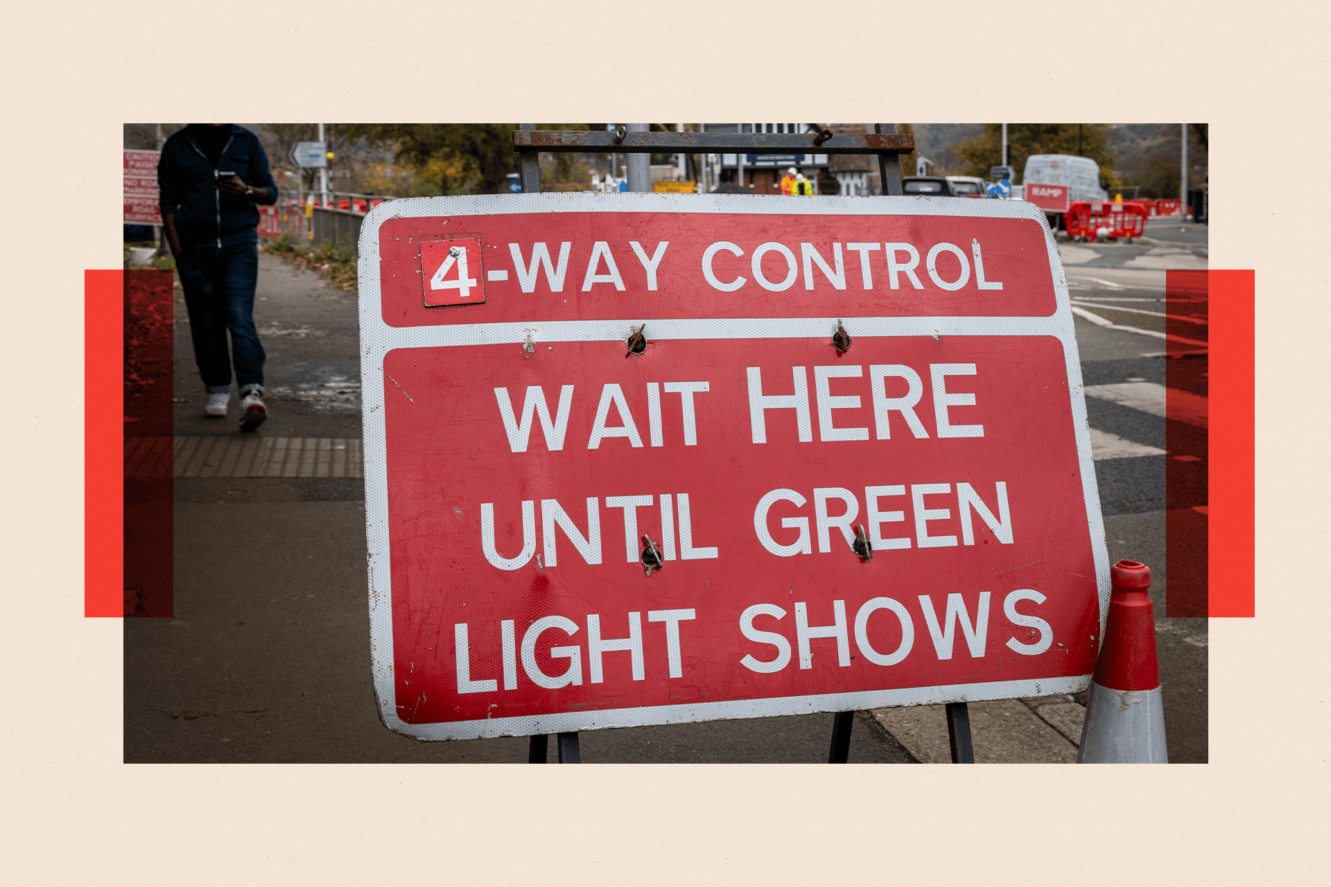 A sign that reads: "4 way control. Wait here until green light shows."