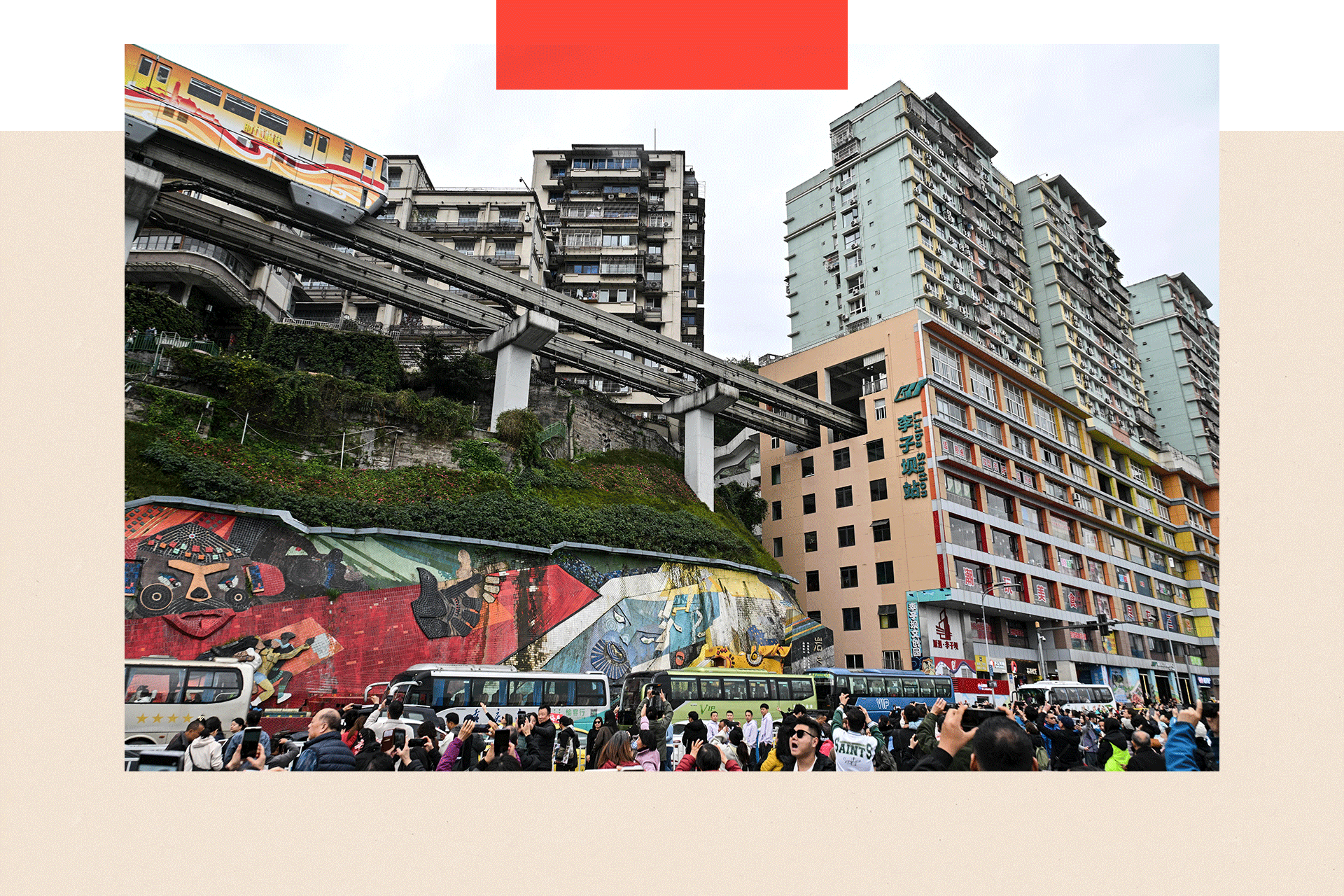 Tourists take pictures of a train arriving in Chongqing in southwestern China