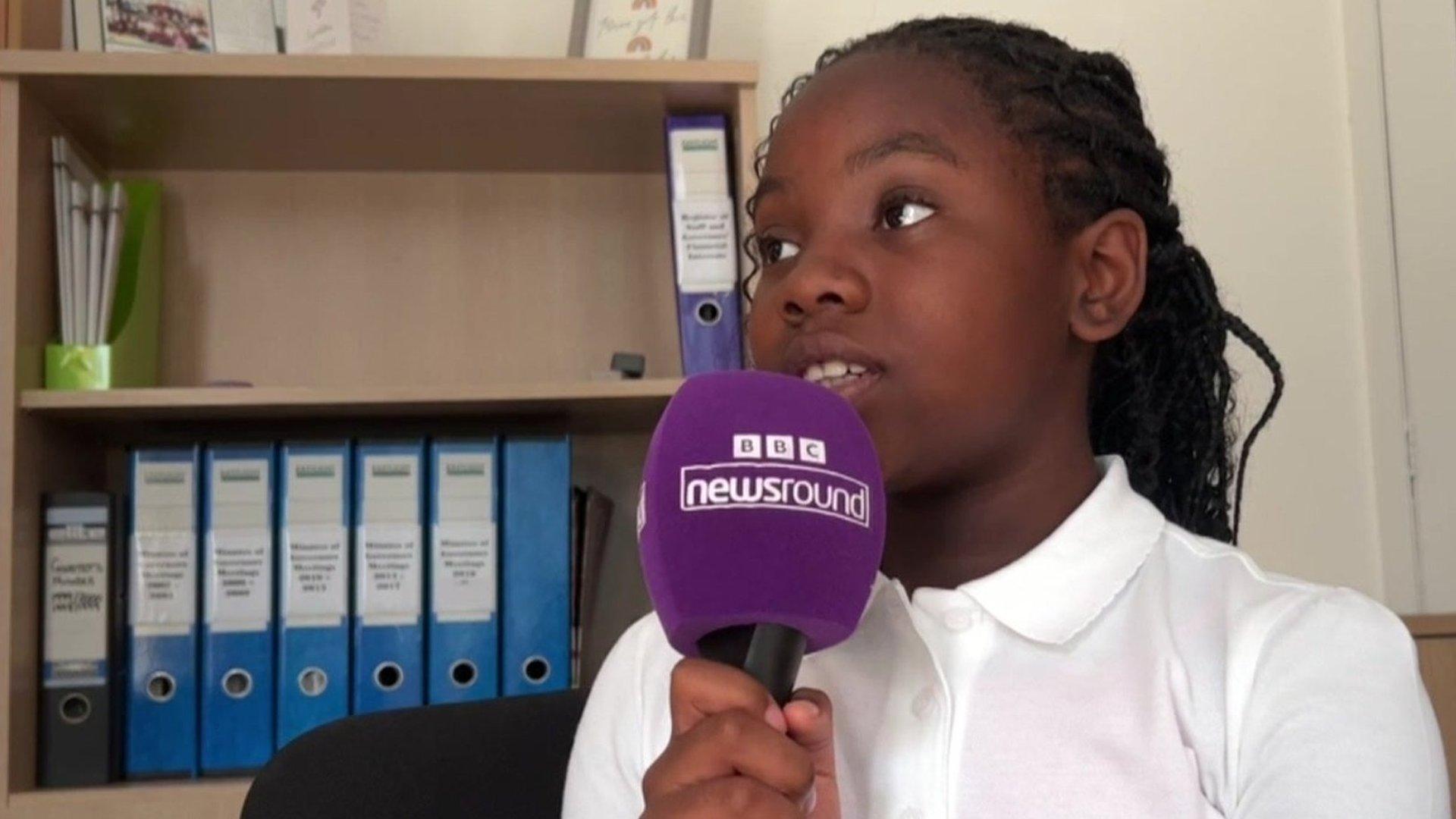 child with Newsround microphone