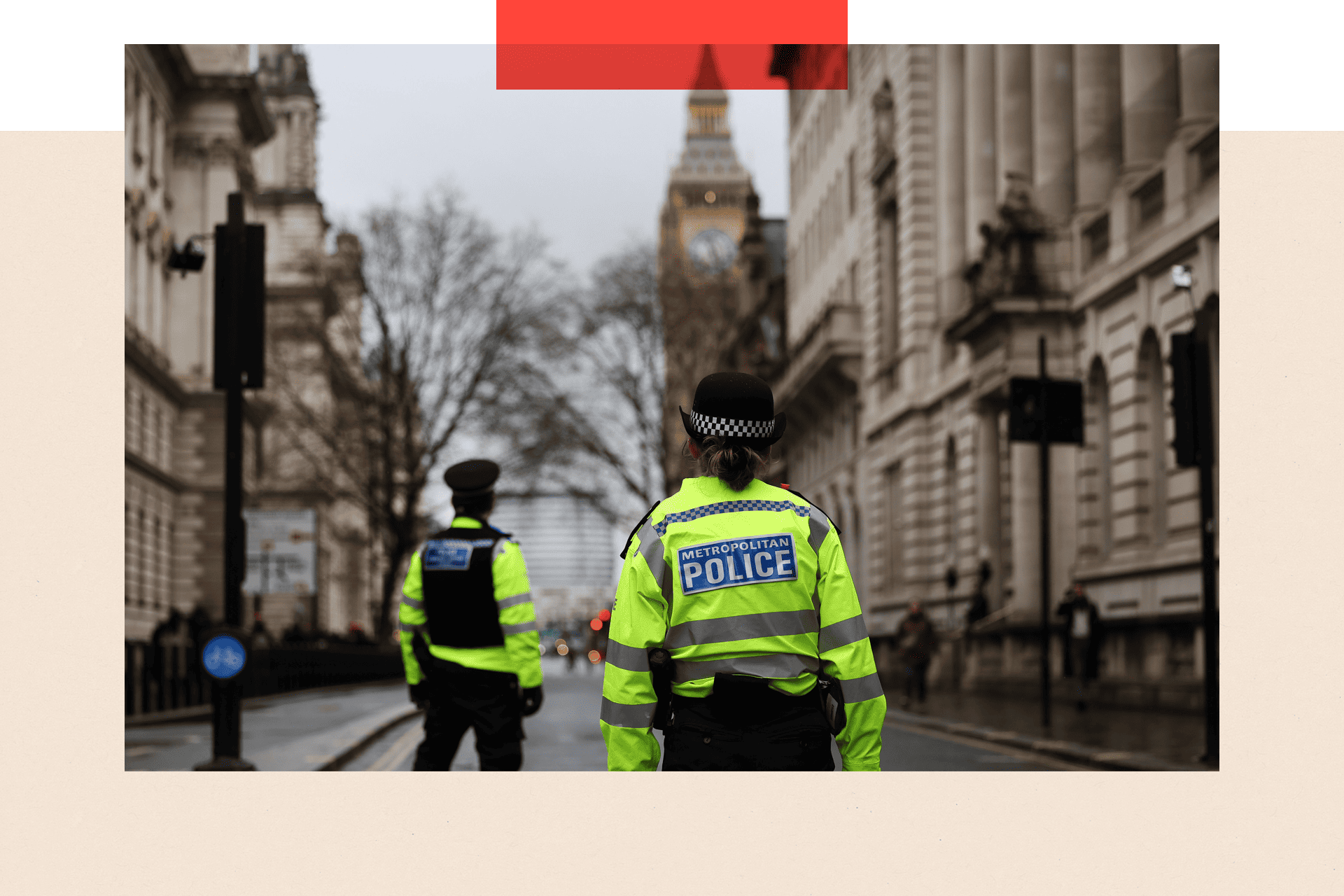 Police officers stand guard in a street in London