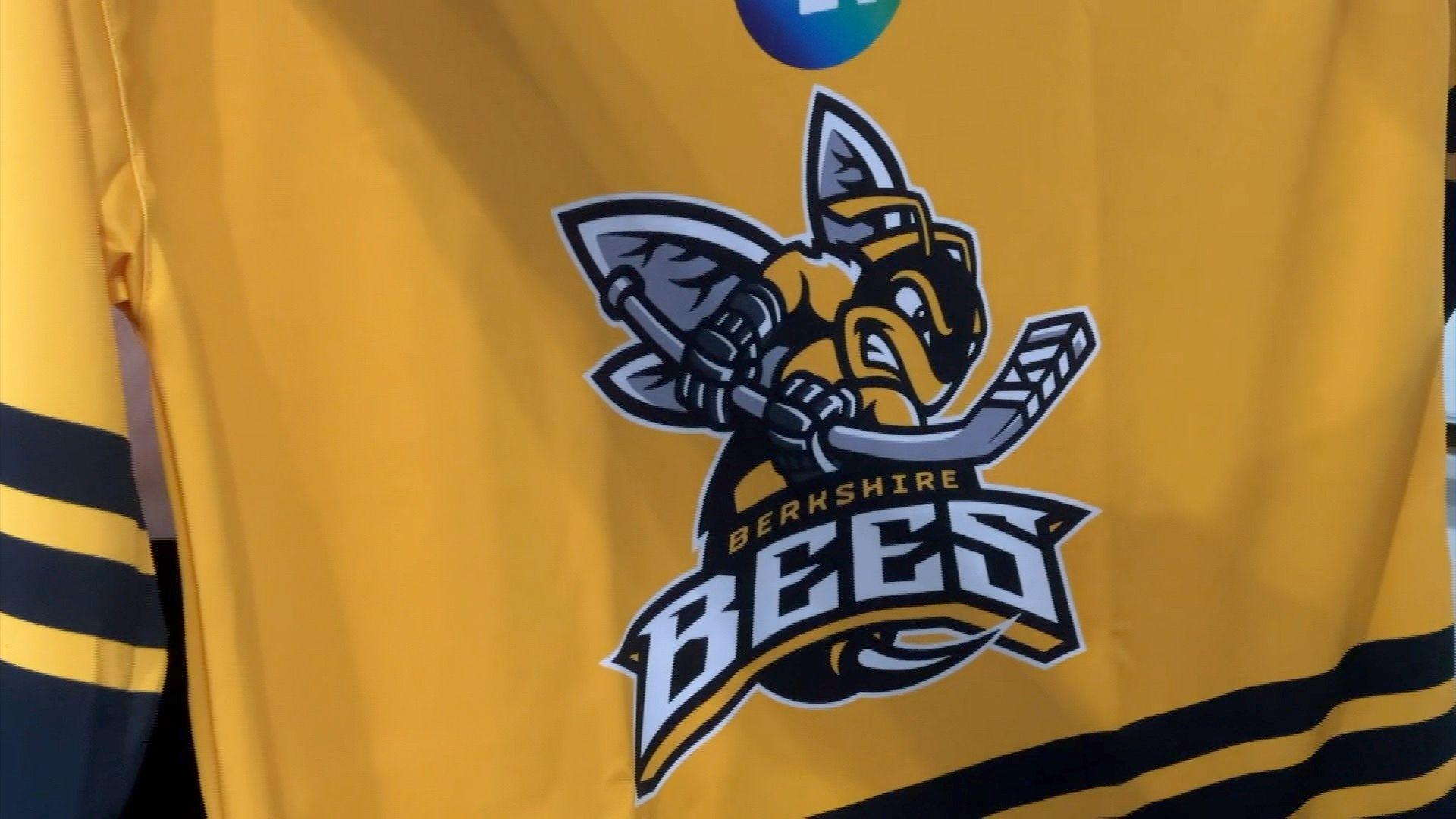 A bright yellow with black striped ice hockey shirt bears the Berkshire Bees logo in the centre