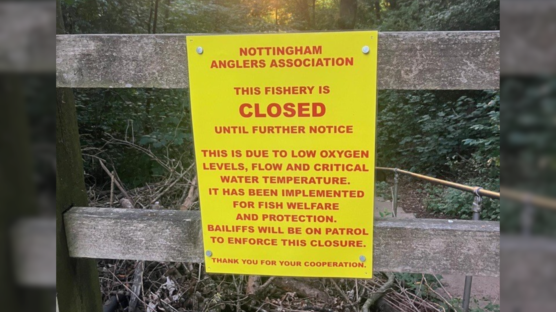 A sign of the Nottingham Anglers Association on a fence leading to a fishing spot near the Stoke Bardolph weir.