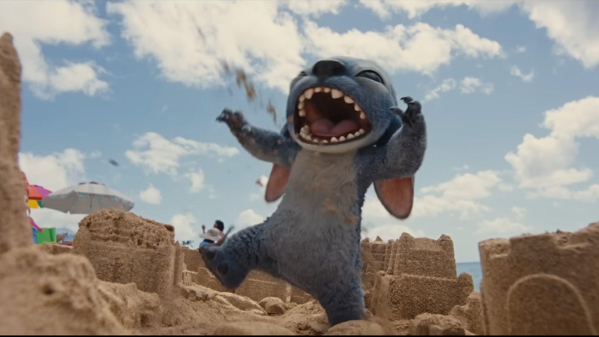 A CGI Stitch is stomping on a sandcastle on the beach