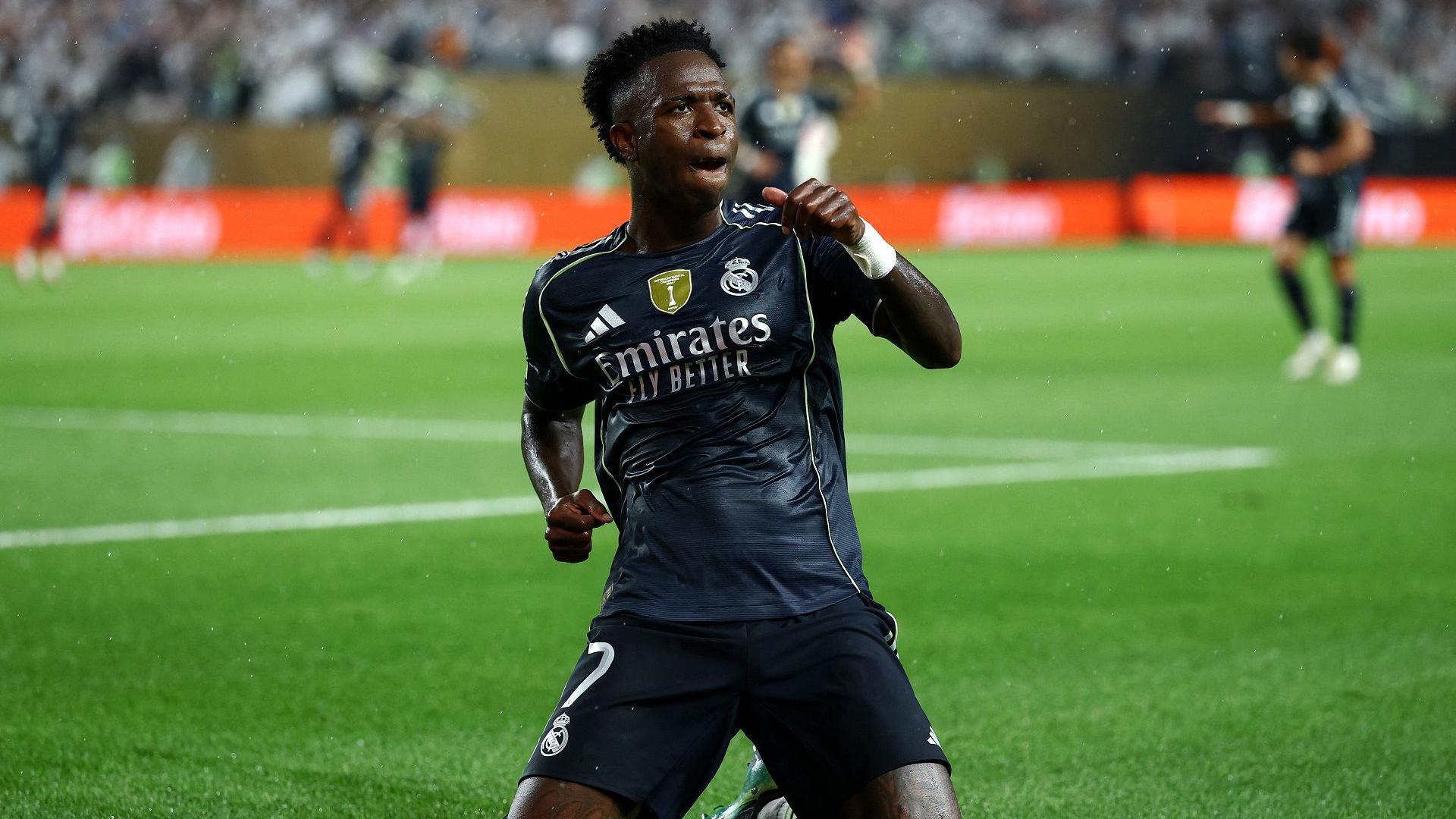 Vinicius Jr slides on his knees to celebrate scoring a goal