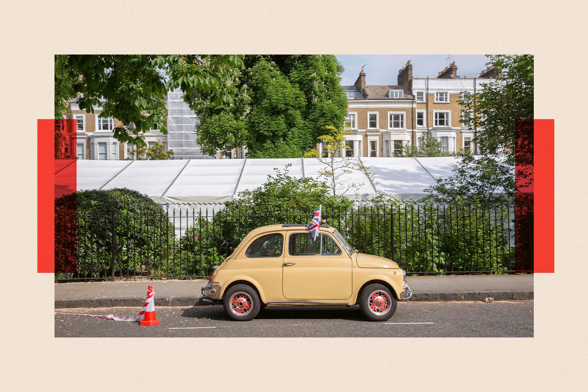 A beige Fiat 500 classic car in a parking bay 