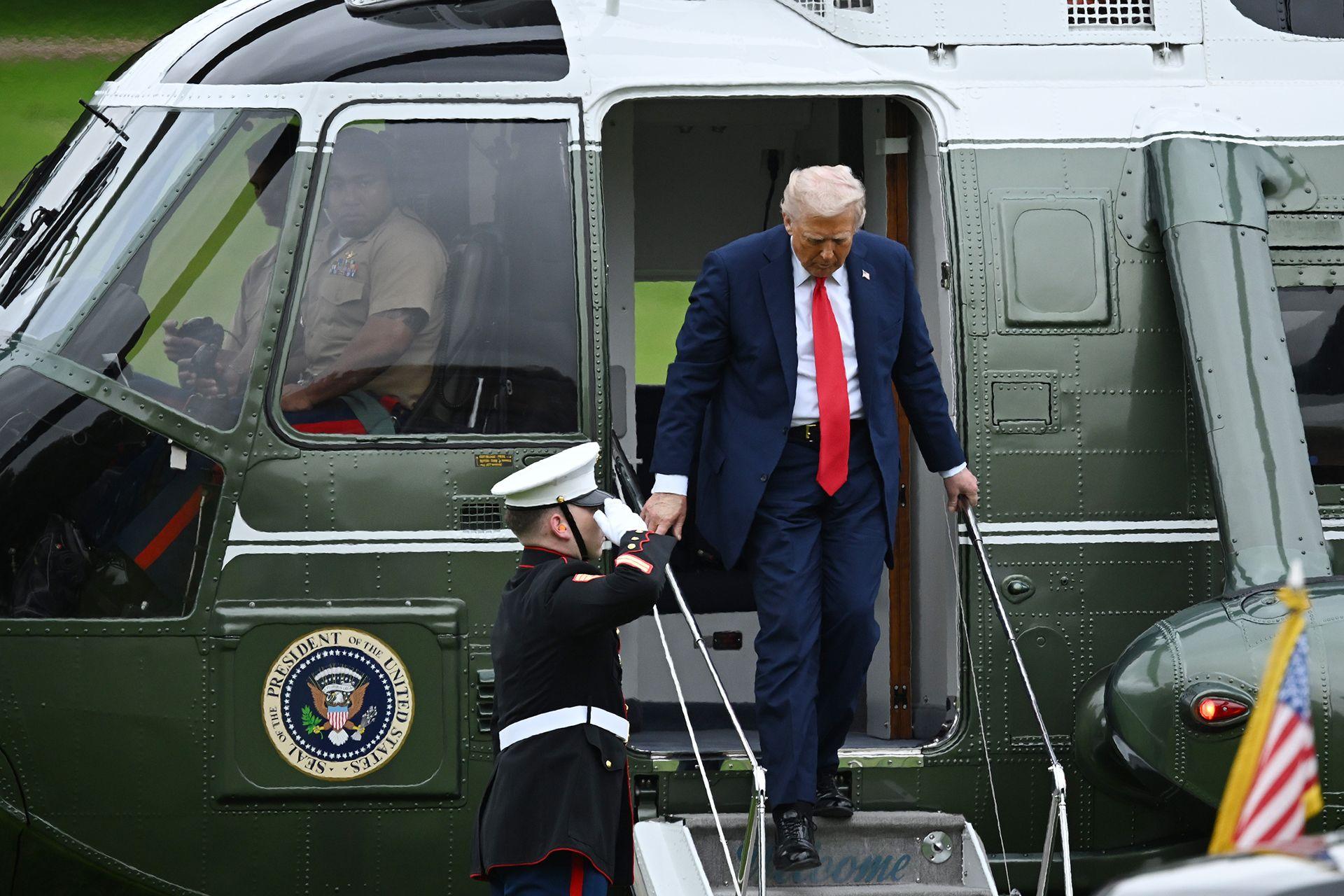 President Donald Trump emerges to walk down the steps of the helicopter at Chequers, the country home of the British prime minister in Aylesbury, England. 