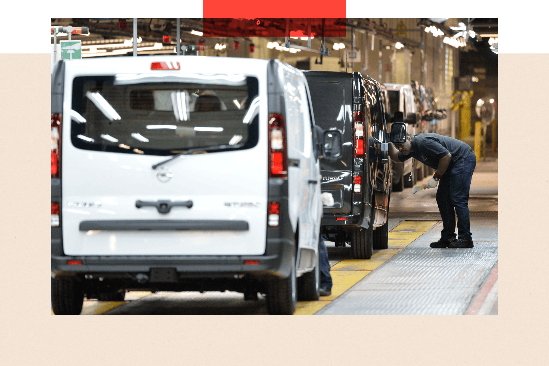 An employee inspects a vehicle at the Vauxhall factory in Luton 