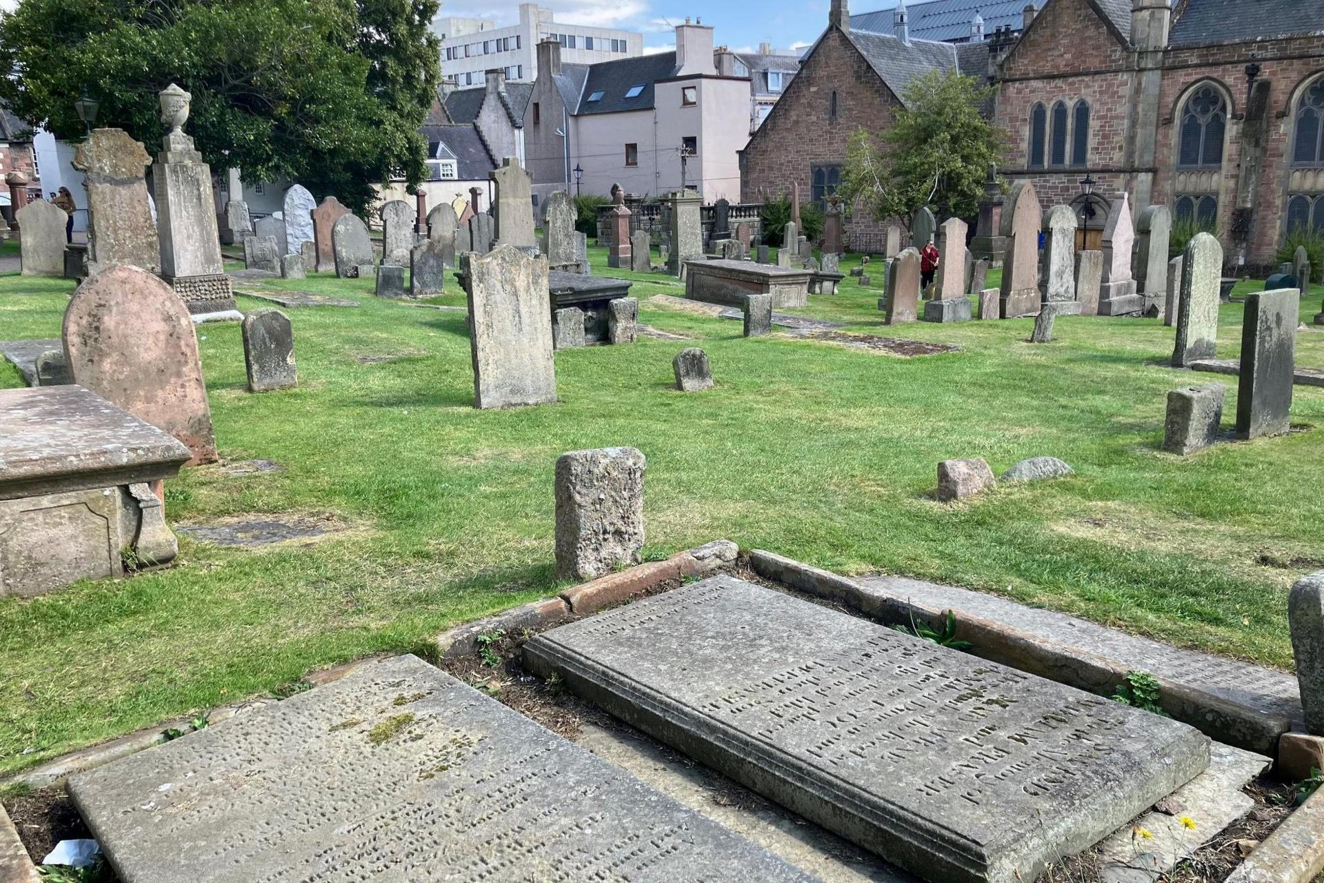 A view across gravestones and other grave markers at Old High Church in Inverness.