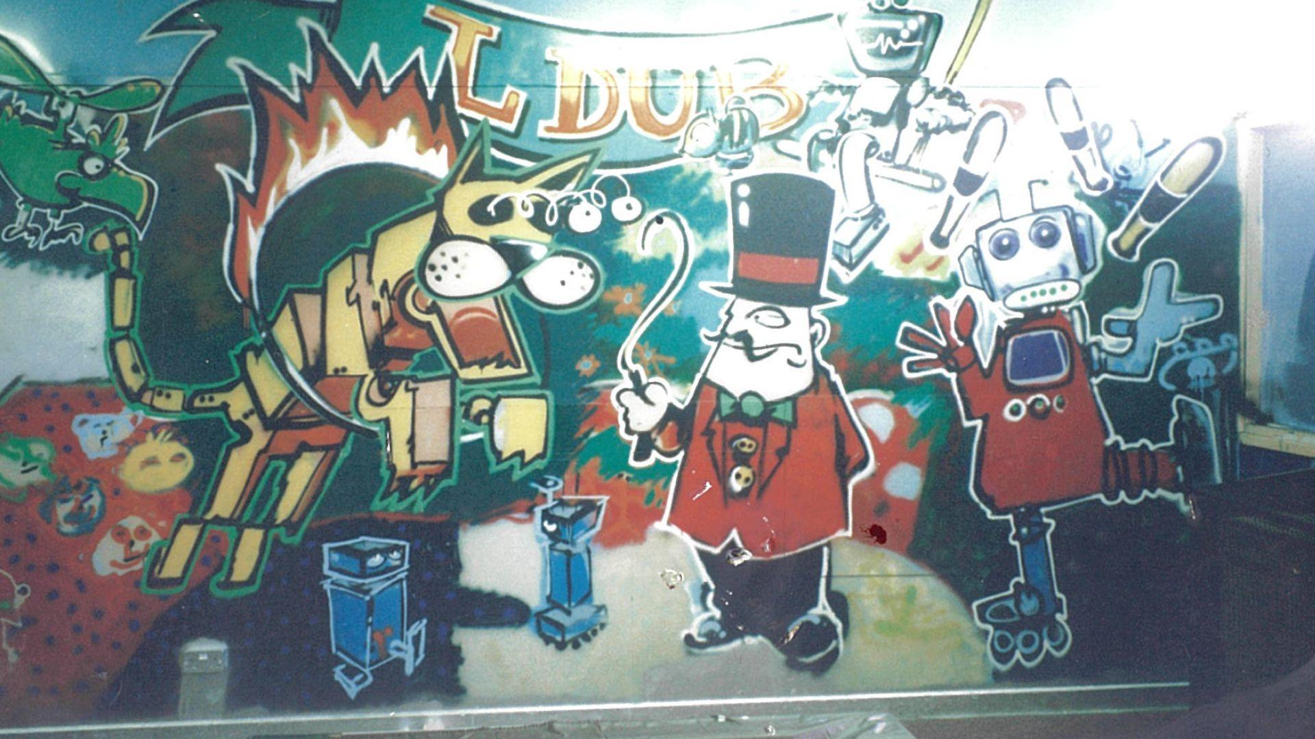 A mural showing robots performing in a circus and an animal jumping through a flaming hoop as its eyes pop out.