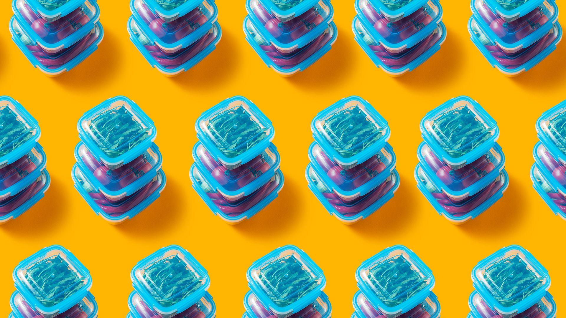 Pattern in plastic lunch boxes with vegetables a yellow background
