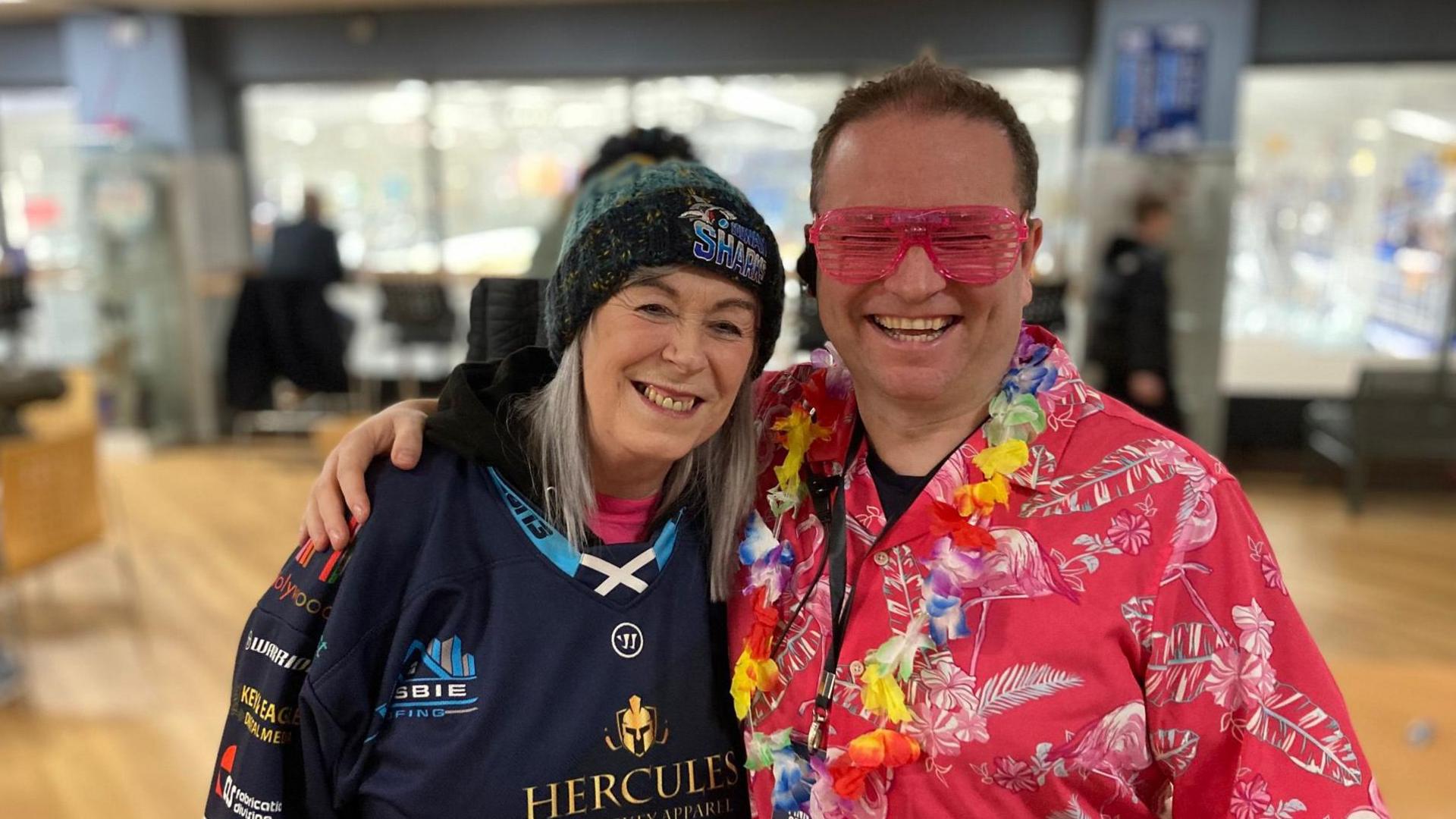 Solway Sharks fan Maureen Cochrane and co-owner John Strange