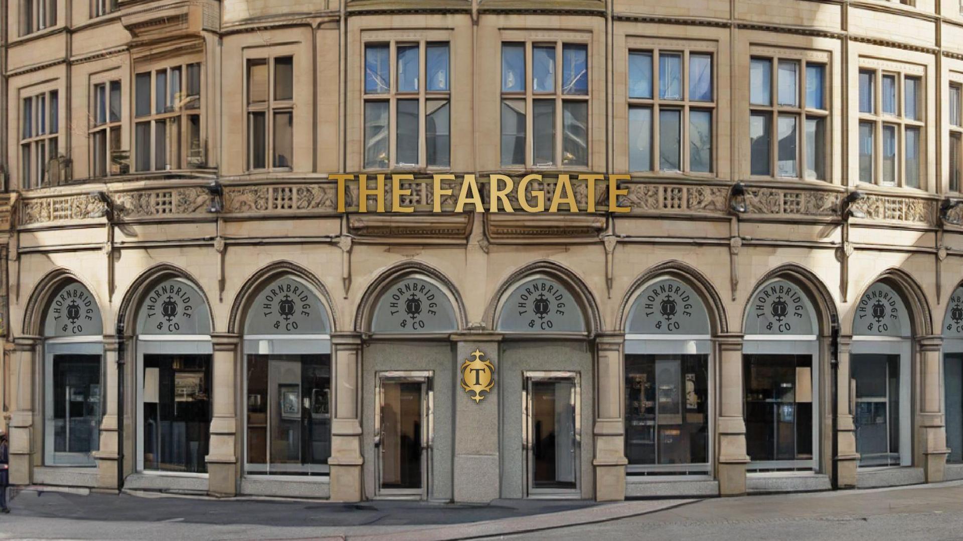 An old stone-build building with many curved archways at ground level. In columns above them are many windows. Gold lettering saying "The Fargate" is at the front of the building above the entrance.
