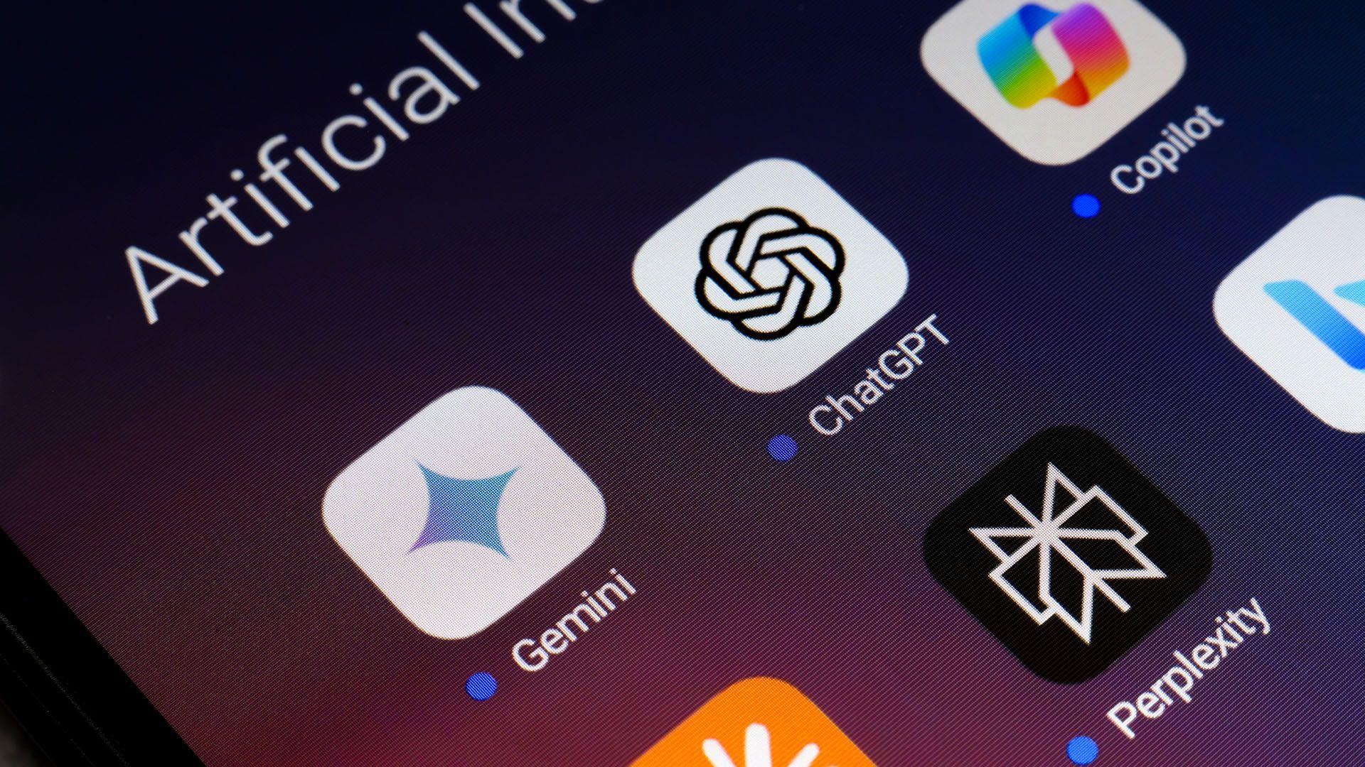 A phone screen with the app icons ChatGPT, Copilot, Gemini and Perplexity displayed