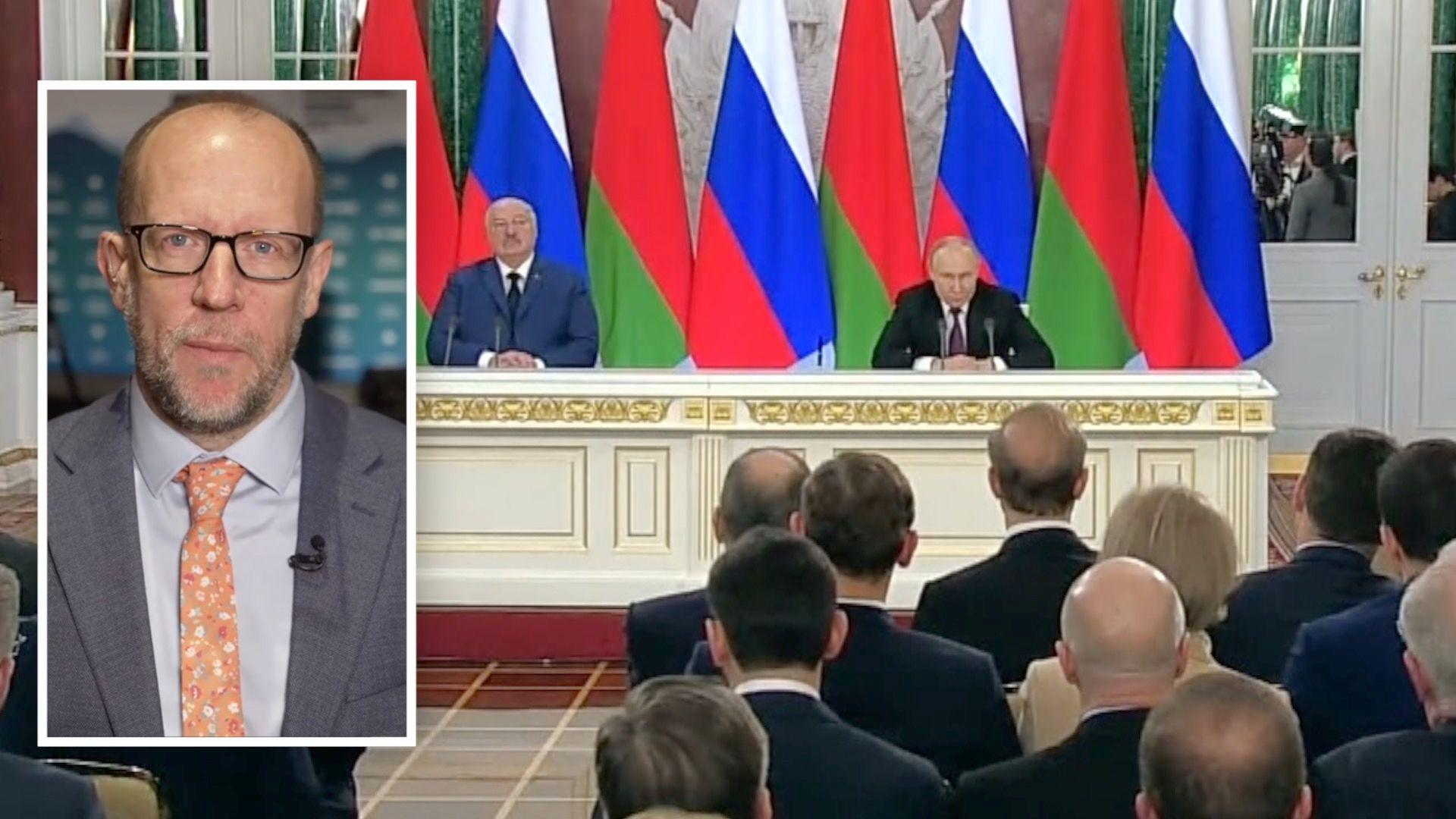 A composite image of Tom Batemen in a suit over an image of Putin's news conference