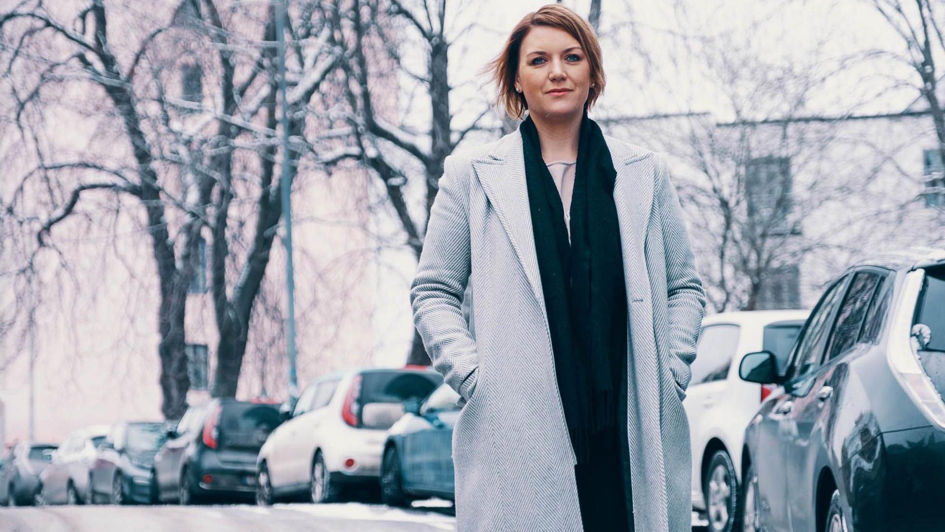 Christina Bu, the secretary general of the Norwegian EV Association, stands on a snowy street