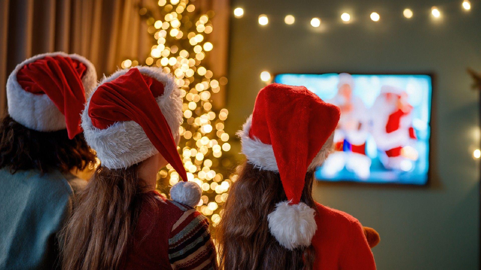 Girls watching Christmas telly. 