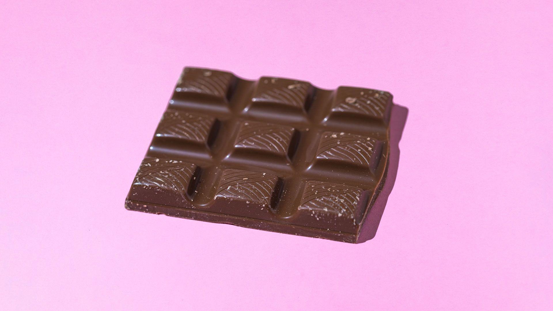 Nine blocks (still together) of dark chocolate in a rectangle shape 