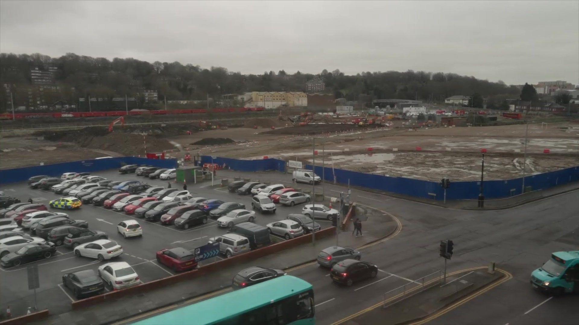 A view from above of the construction site at Power Court, close to a busy car park.