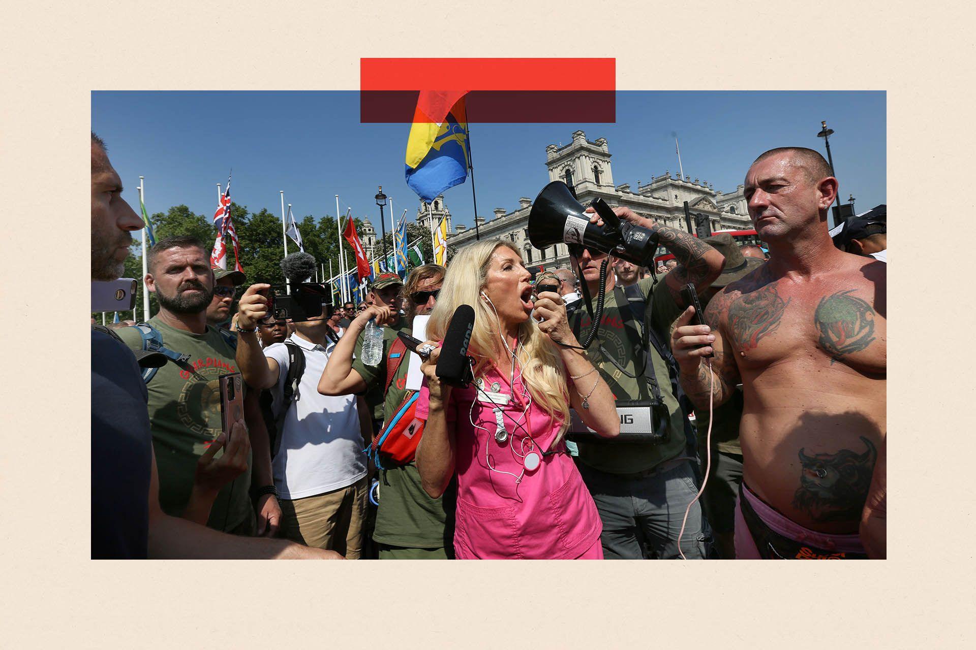 Kate Shemirani addresses protesters through a megaphone