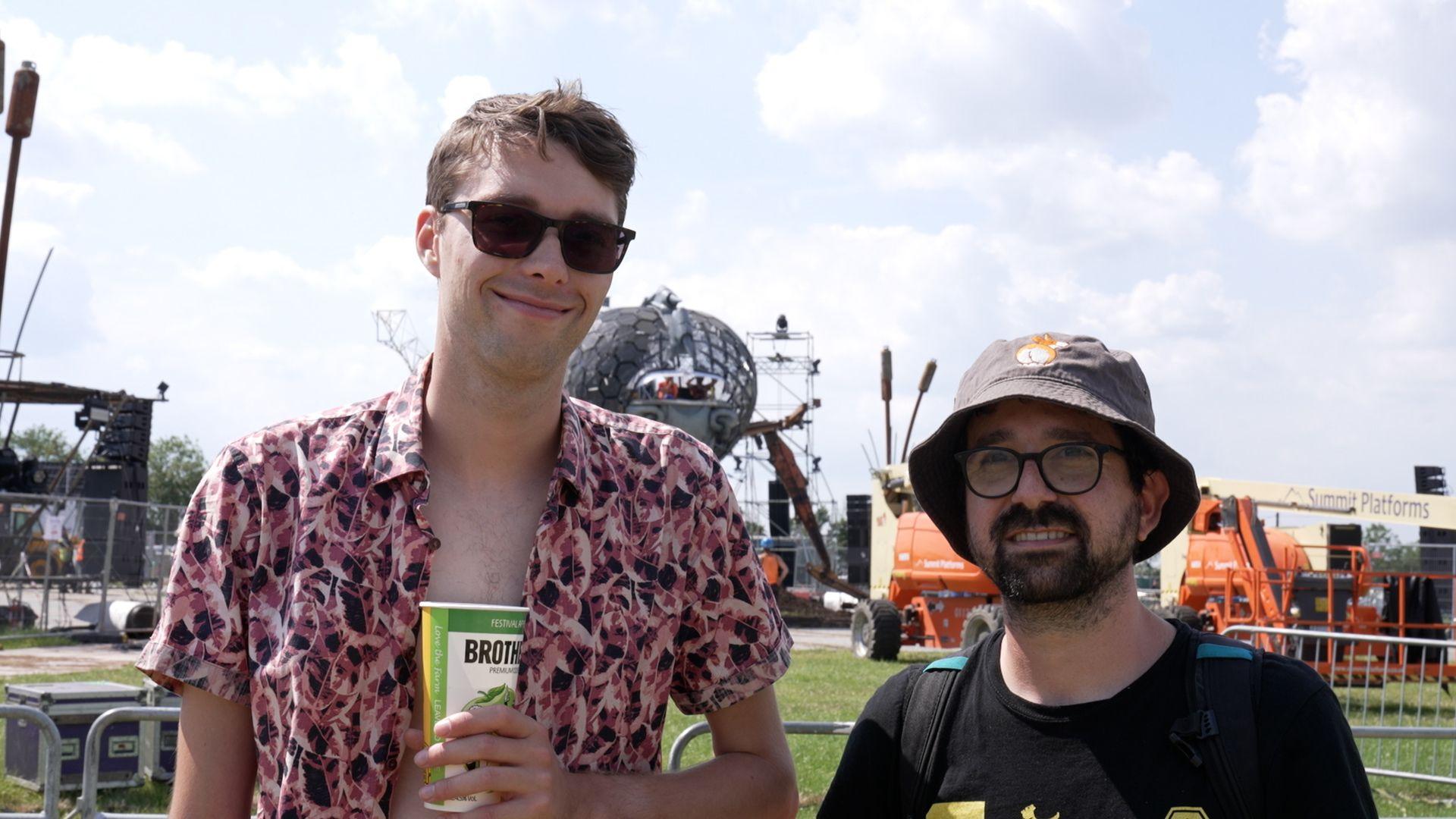 Henno Tams and Nam Goldstein stood in front of the new dragonfly installation at Glastonbury Festival.