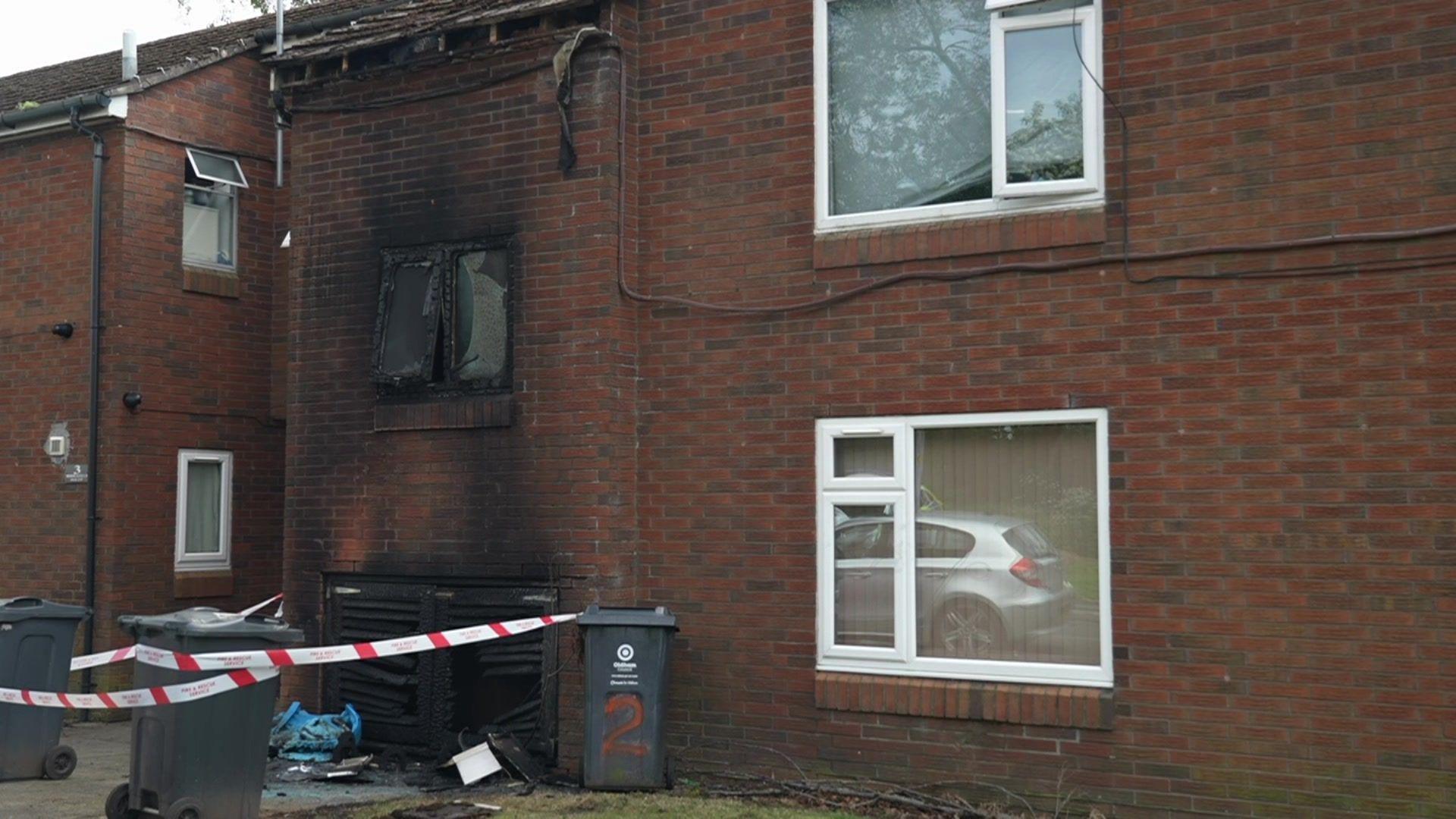 A cordon outside a property with fire damage