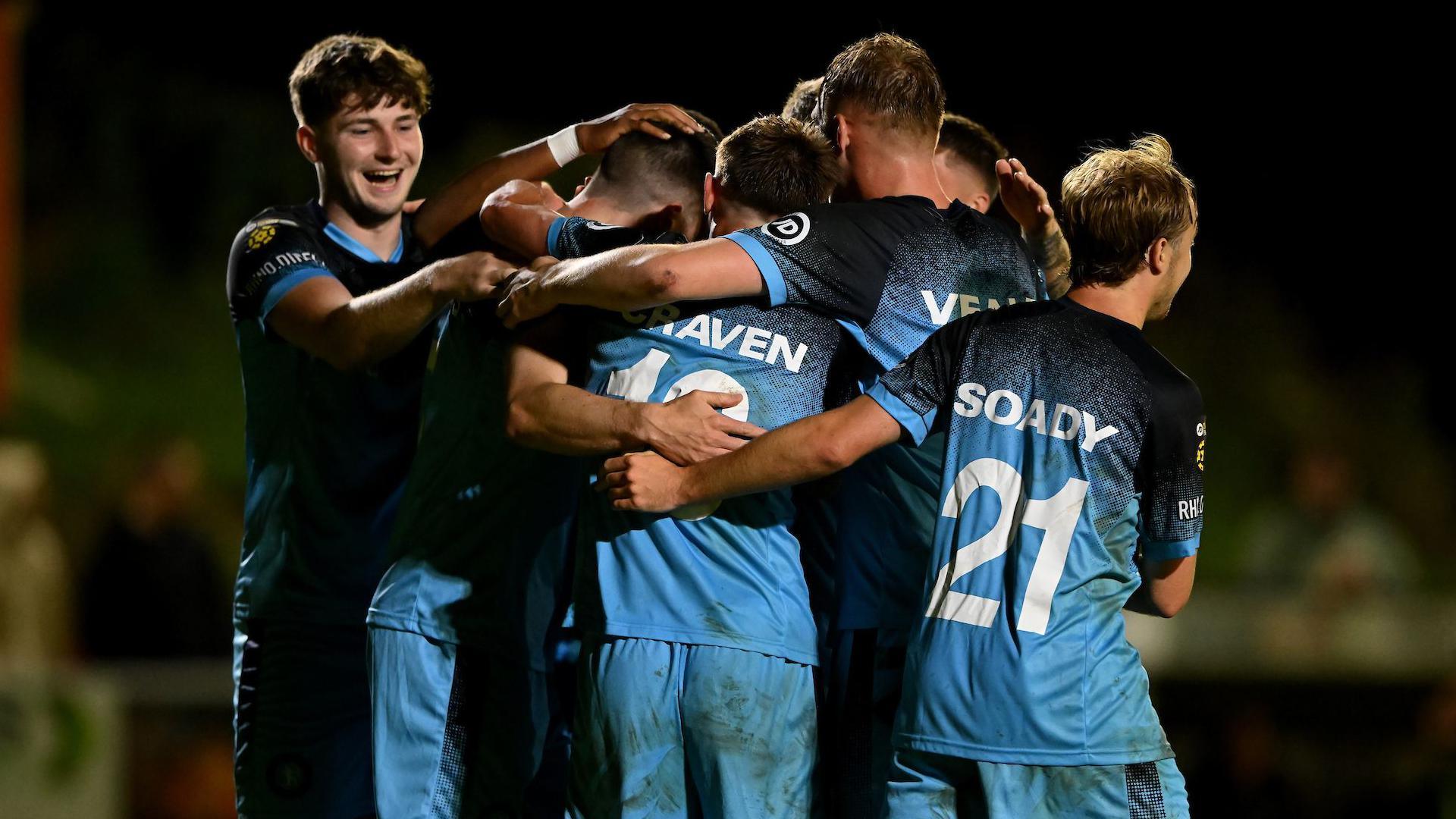 CJ Craven celebrates with team-mates after scoring Cardiff Met's fourth goal